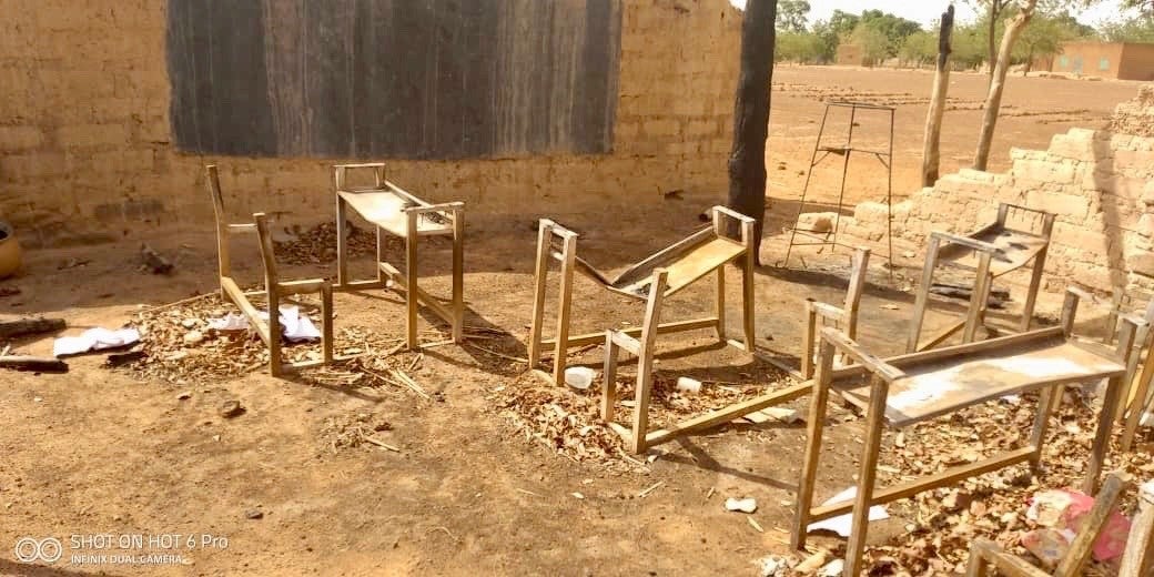 Destroyed desks outside of a building