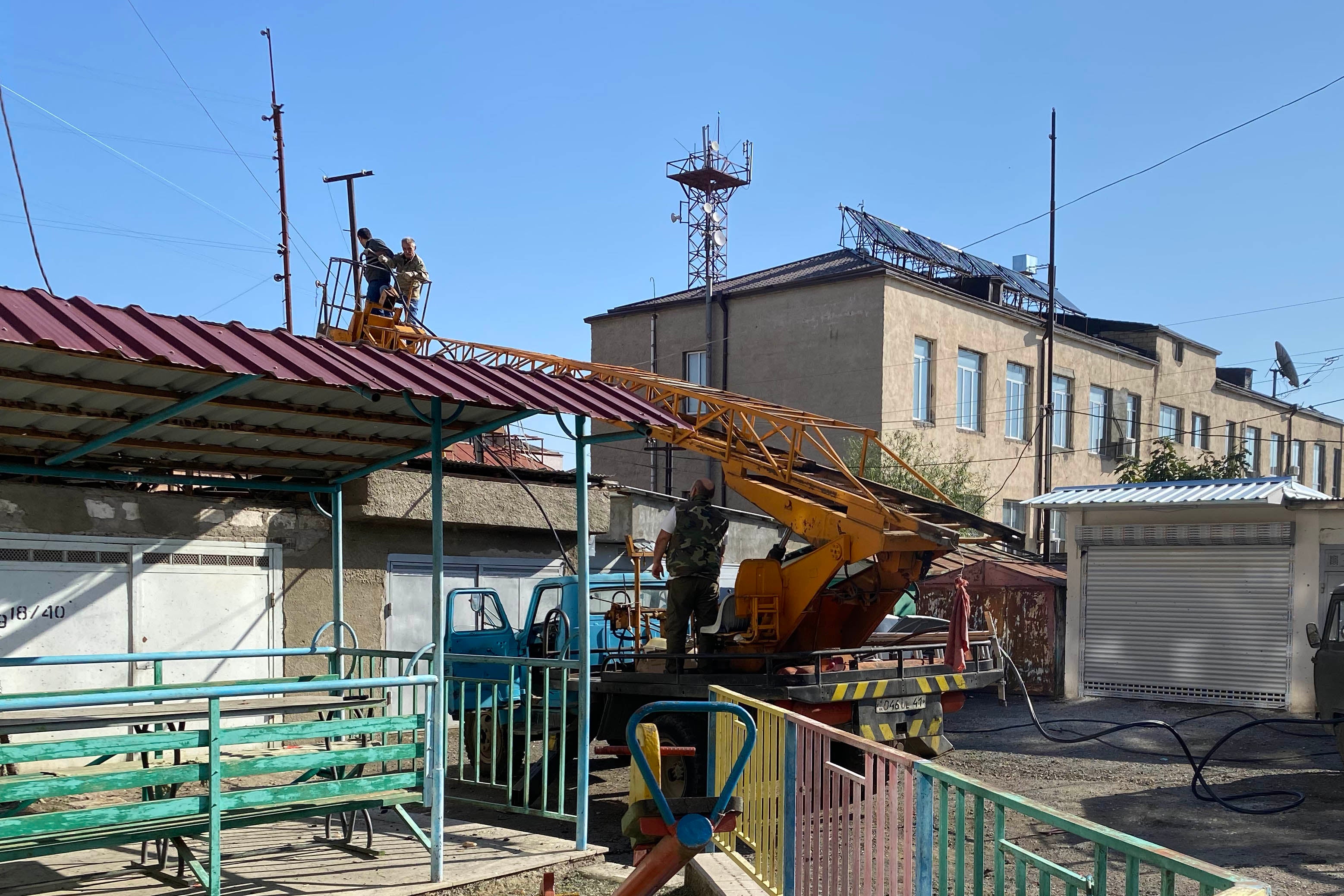 Workers attempt to repair damaged electrical lines 