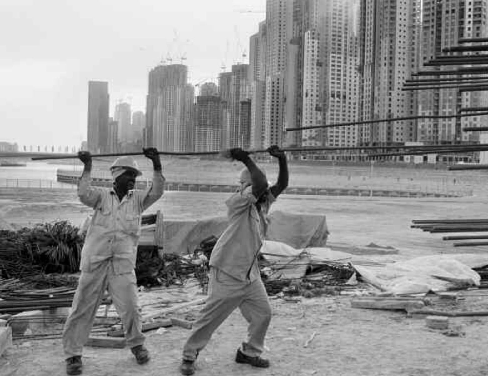 Foreign laborers work to build the Jumeirah Beach luxury apartment complex. 