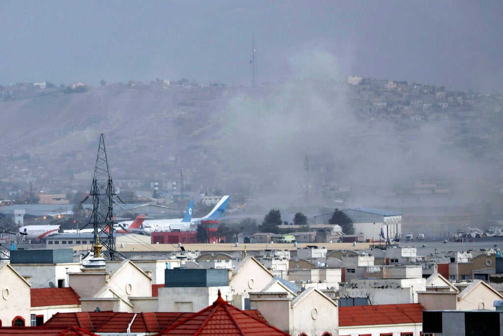 Smoke rises from an explosion outside the airport in Kabul, Afghanistan on August 26, 2021.