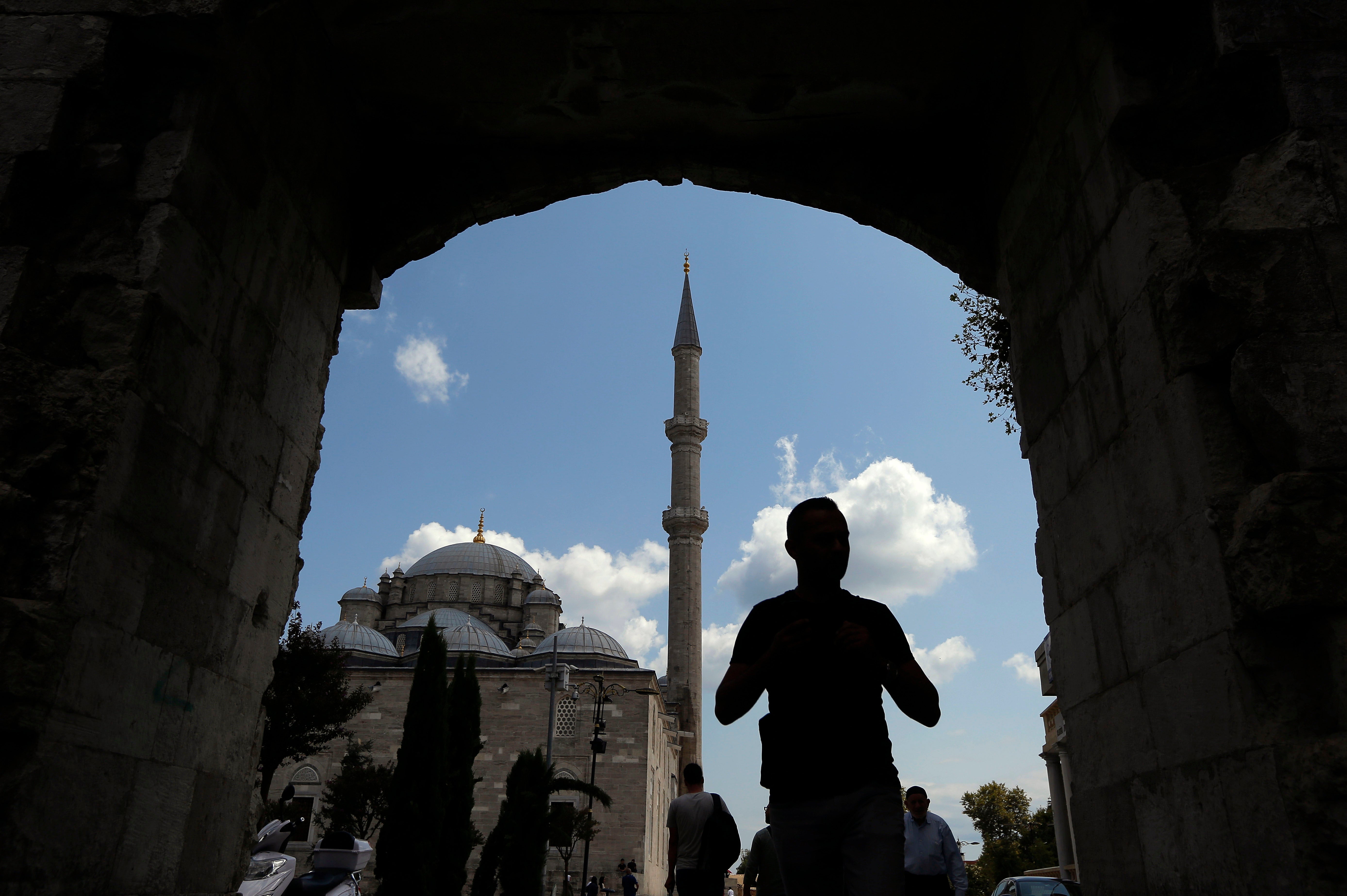 A man walks near Fatih mosque in Istanbul, Turkey.