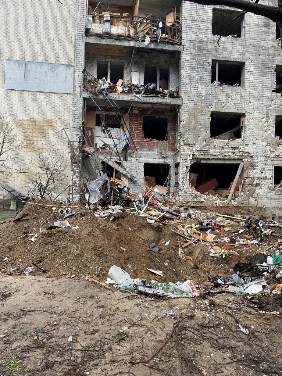 Impact crater and damage caused to residential buildings 