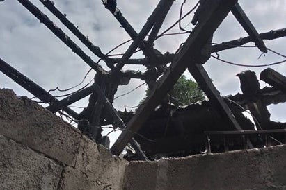 The destroyed rooftop of a house burned by Cameroonian soldiers in Belo’s Bobong neighborhood on June 11, 2022