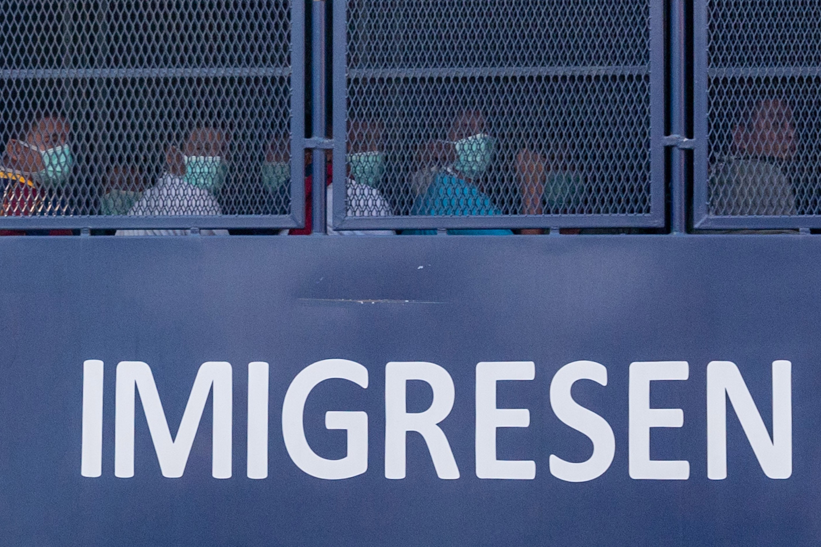 An immigration vehicle takes Myanmar nationals to a Malaysian naval base for deportation, February 23, 2021.