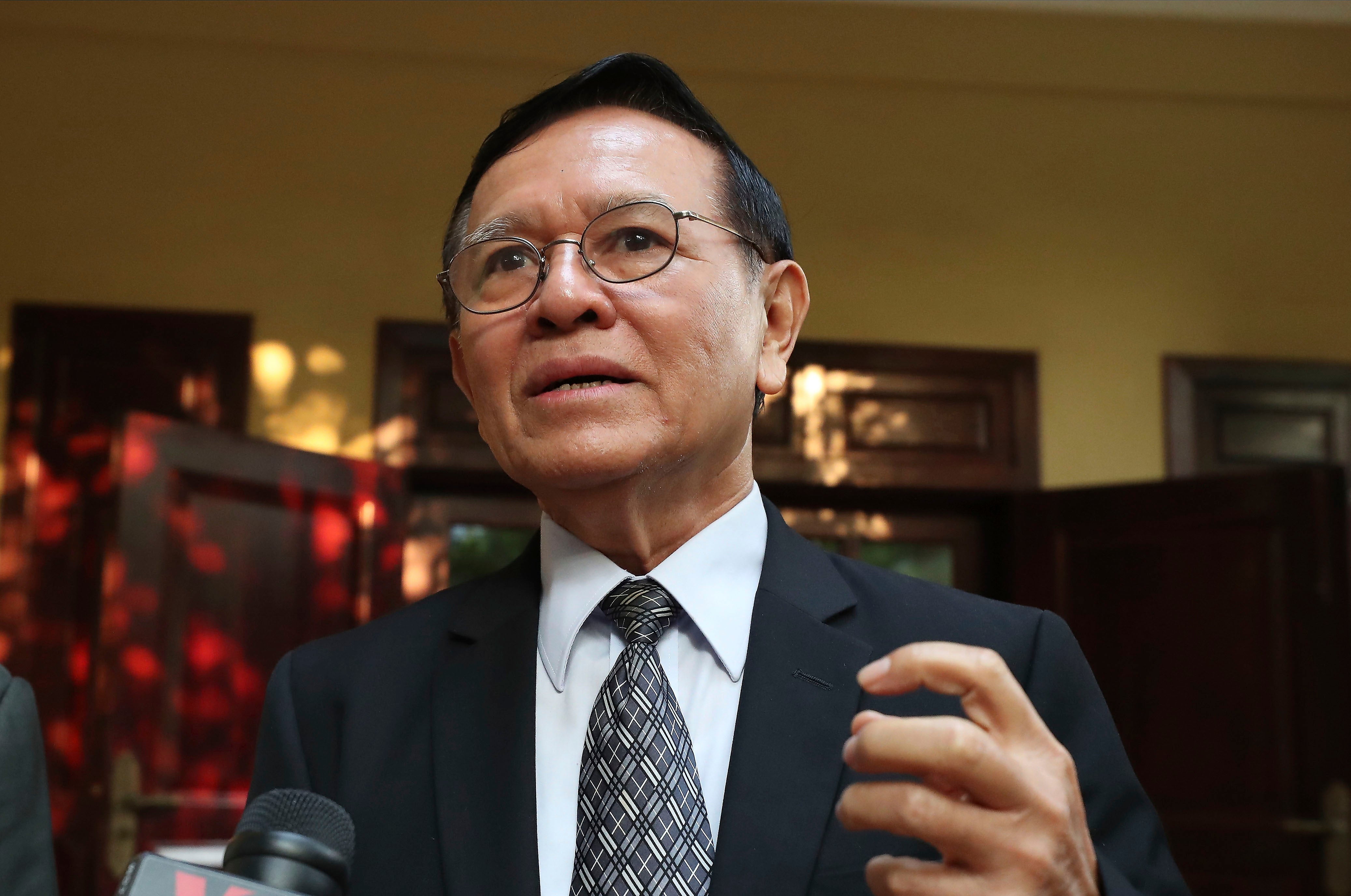 Cambodia’s opposition leader Kem Sokha talks to the media at his home before leaving for a court hearing in Phnom Penh.