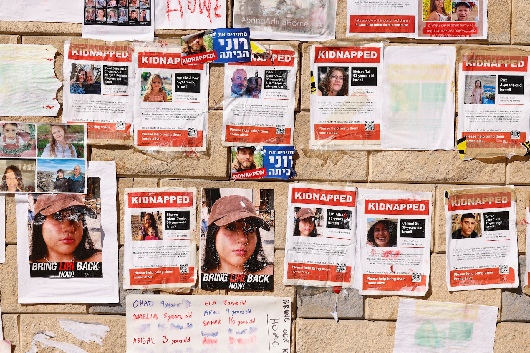 Photographs of Israelis taken as hostages during an October 7 attack by Hamas-led fighters, at a protest demanding their release, outside the HaKirya military base in Tel Aviv, Israel, on October 17, 2023. 