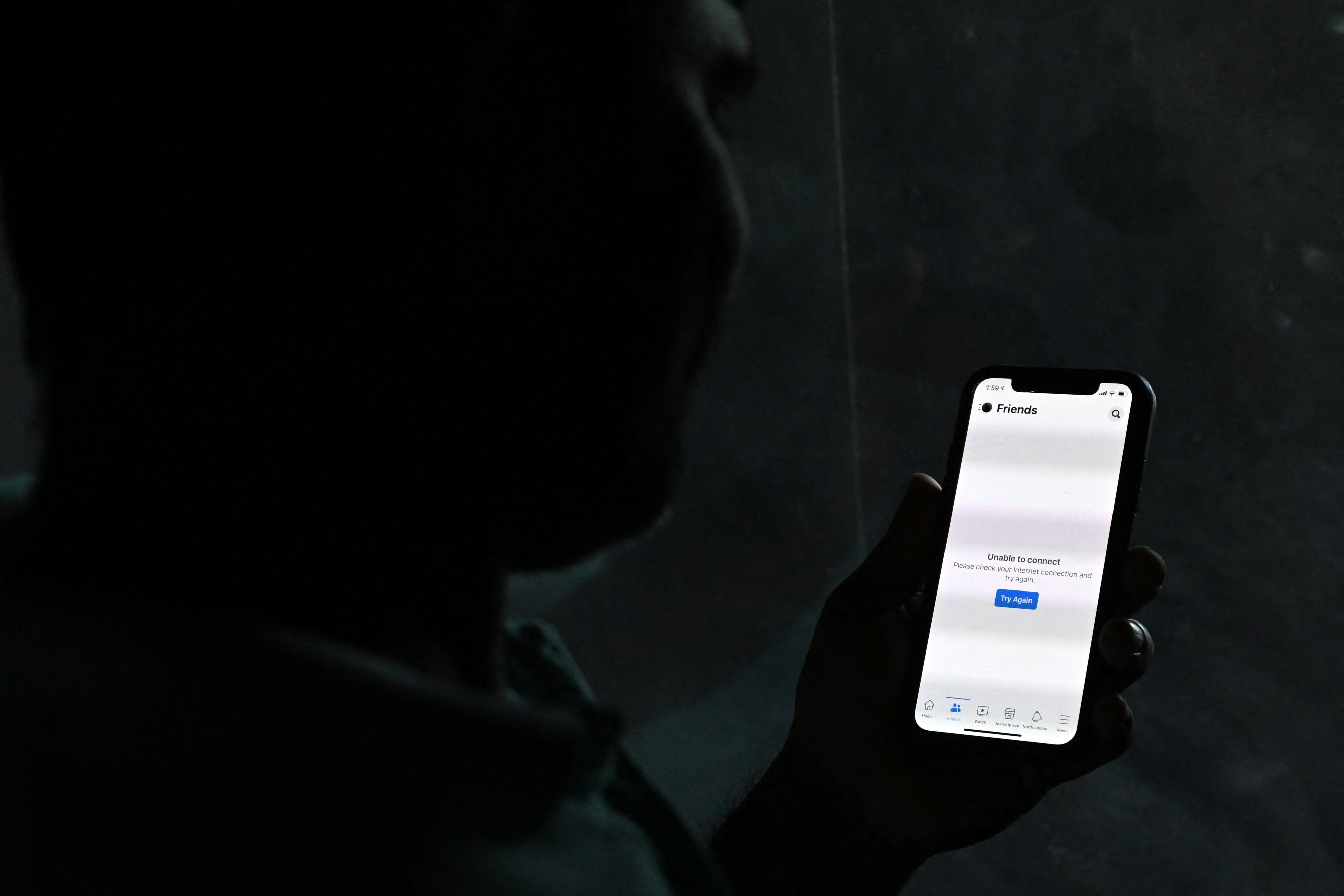 An internet user is unable to connect as he tries to log into Facebook Messenger, in Colombo, Sri Lanka, April 3, 2022. 