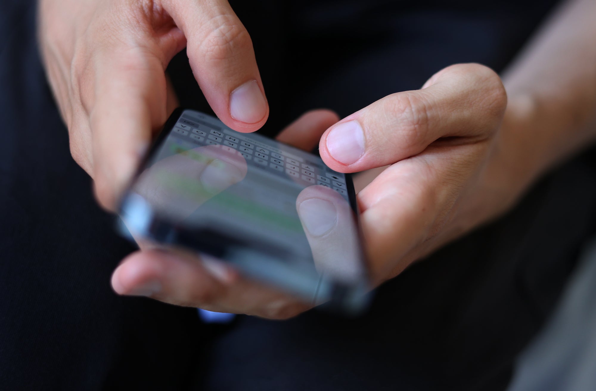 A message is typed on a smartphone, July 2022. 