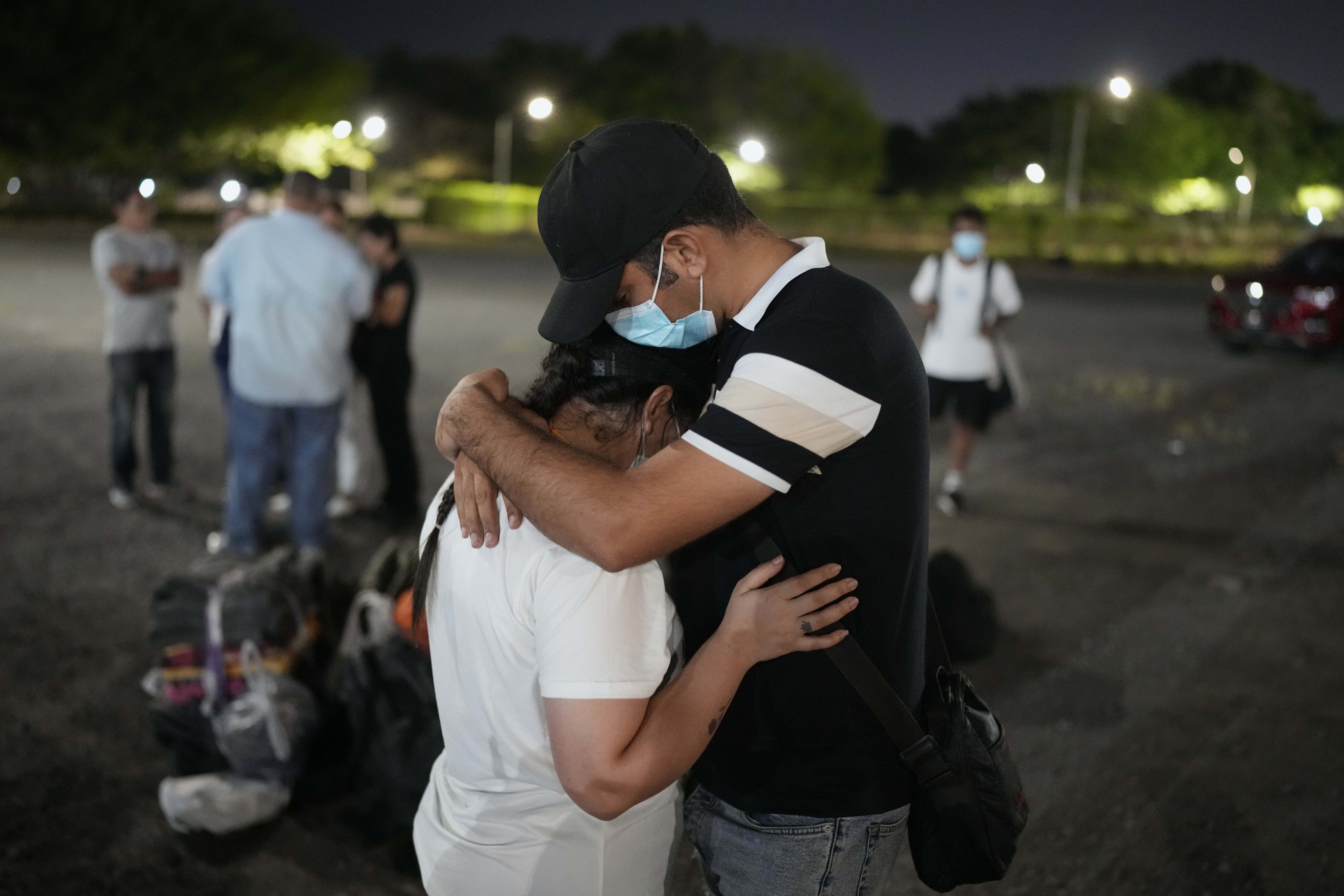 Asylum seekers embrace upon arriving in Panama City, Panama
