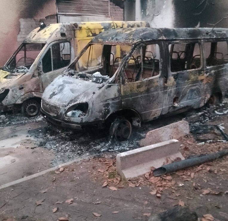 Aftermath of a drone attack on two hospital ambulances parked at the Kherson Regional Oncology Center @ 2025 Kherson Prosecution Office via Telegram