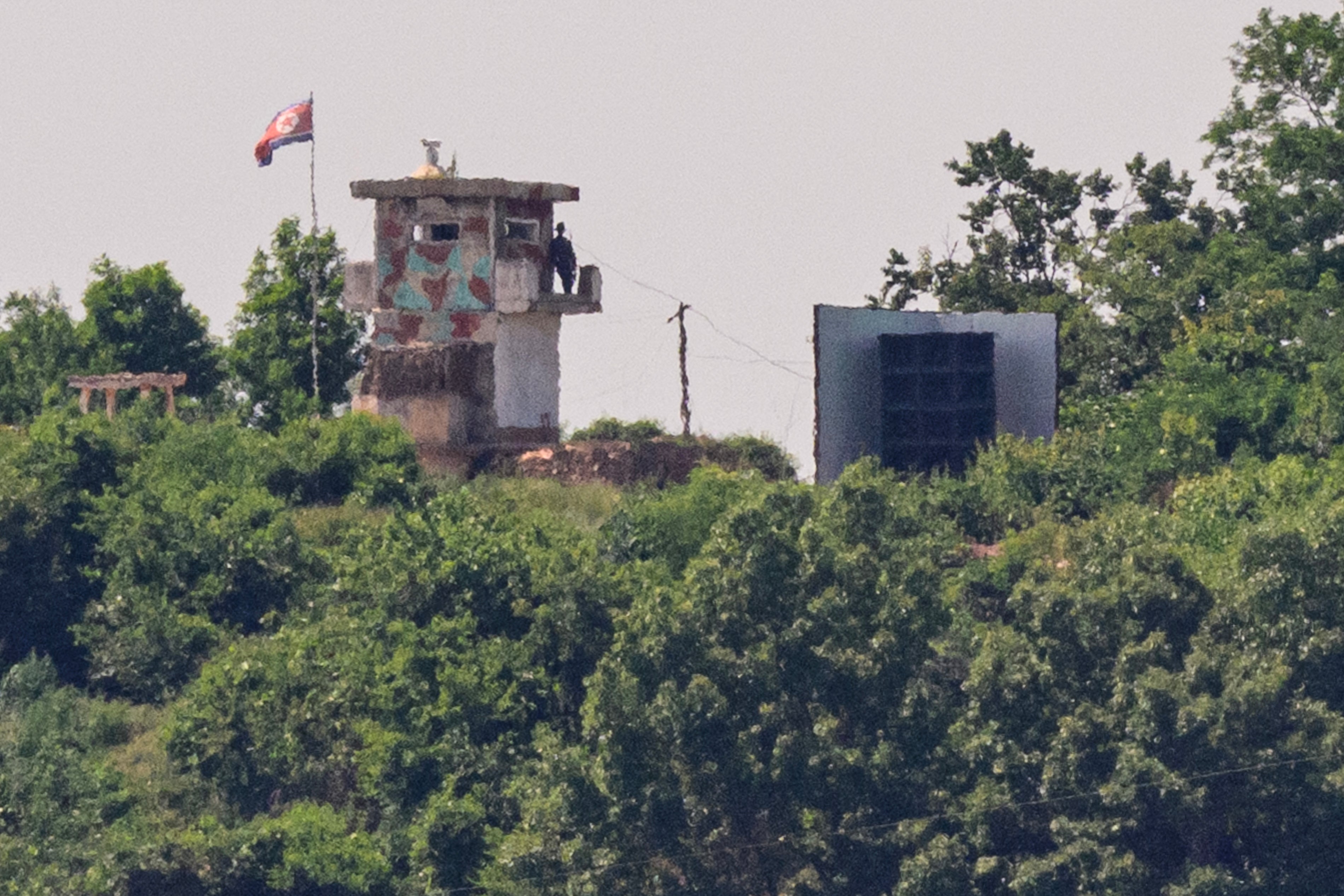 A North Korean soldier on a watch tower on the edge of the demilitarized zone dividing North Korea and South Korea, June 12, 2025.