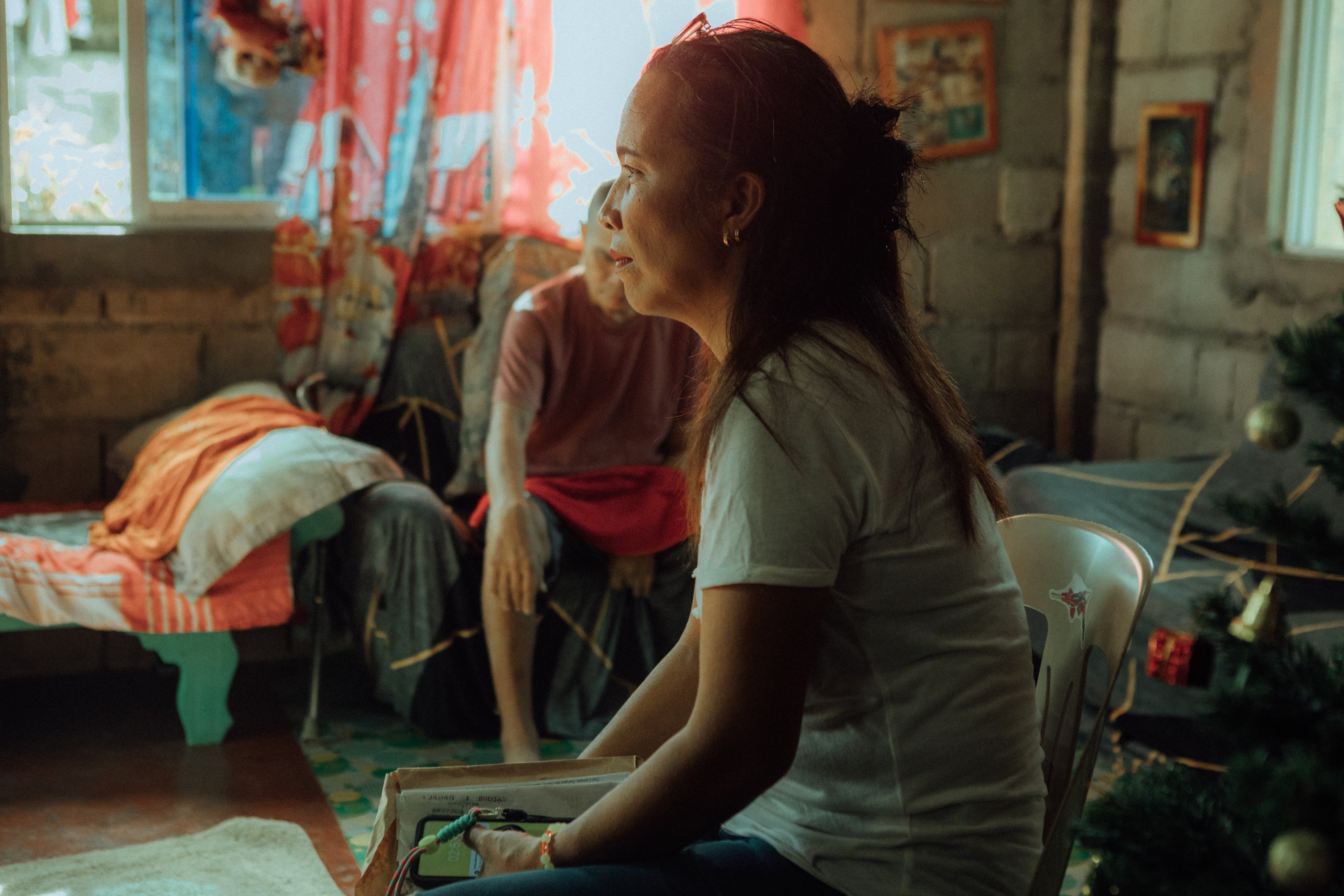 Mirasol at home in the No Build Zone with her husband in Del Carmen, Siargao, Philippines, 2025.