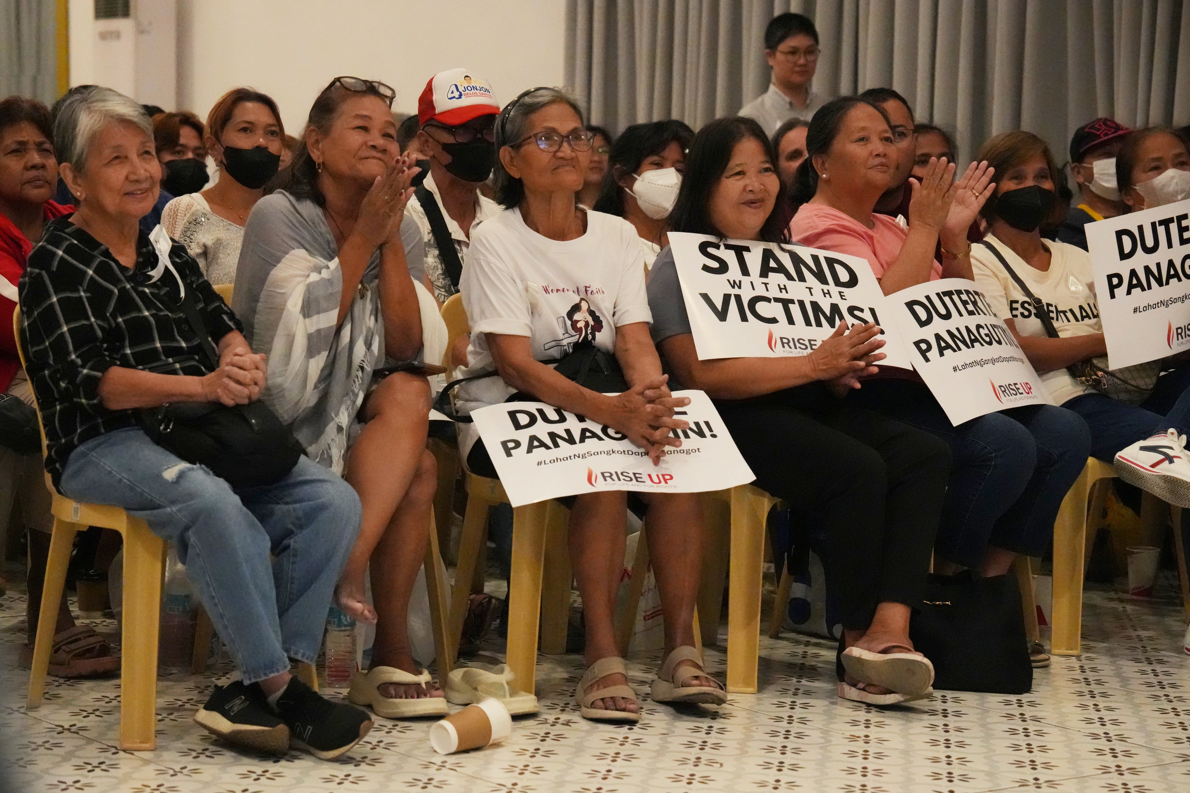 Families of victims of the “war on drugs” watch a live stream 