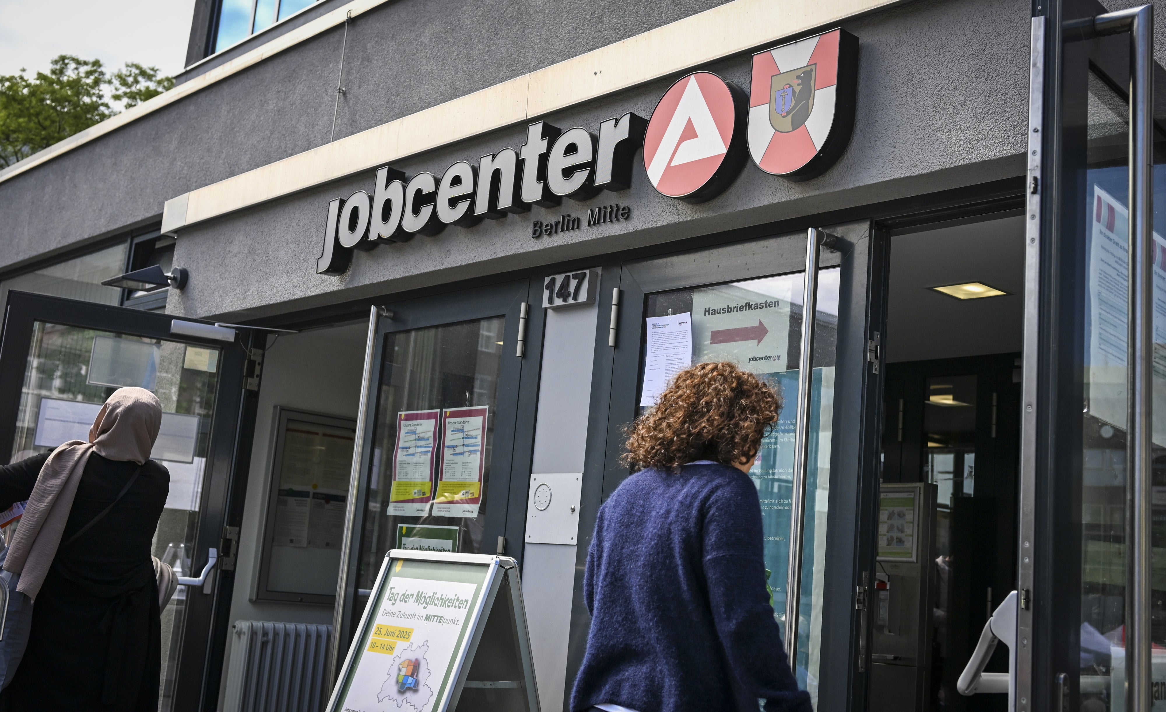 Two women visit a Jobcenter in Berlin, Germany, June 25, 2025
