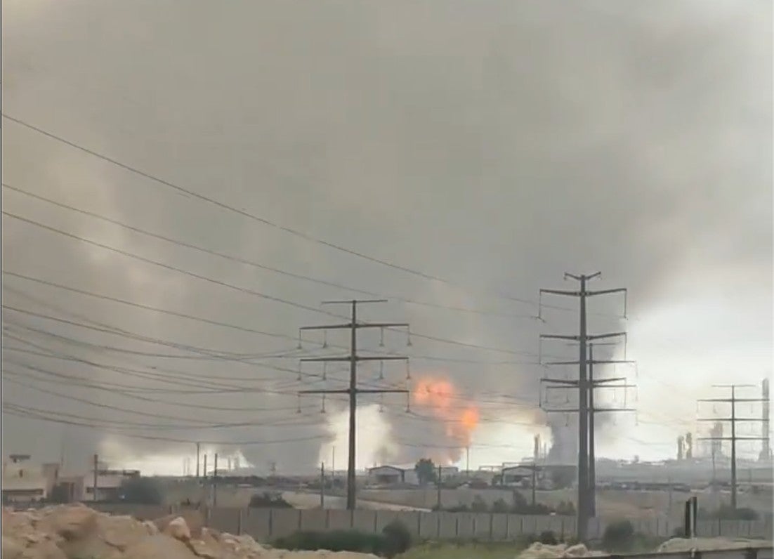 Smoke rising from a refinery