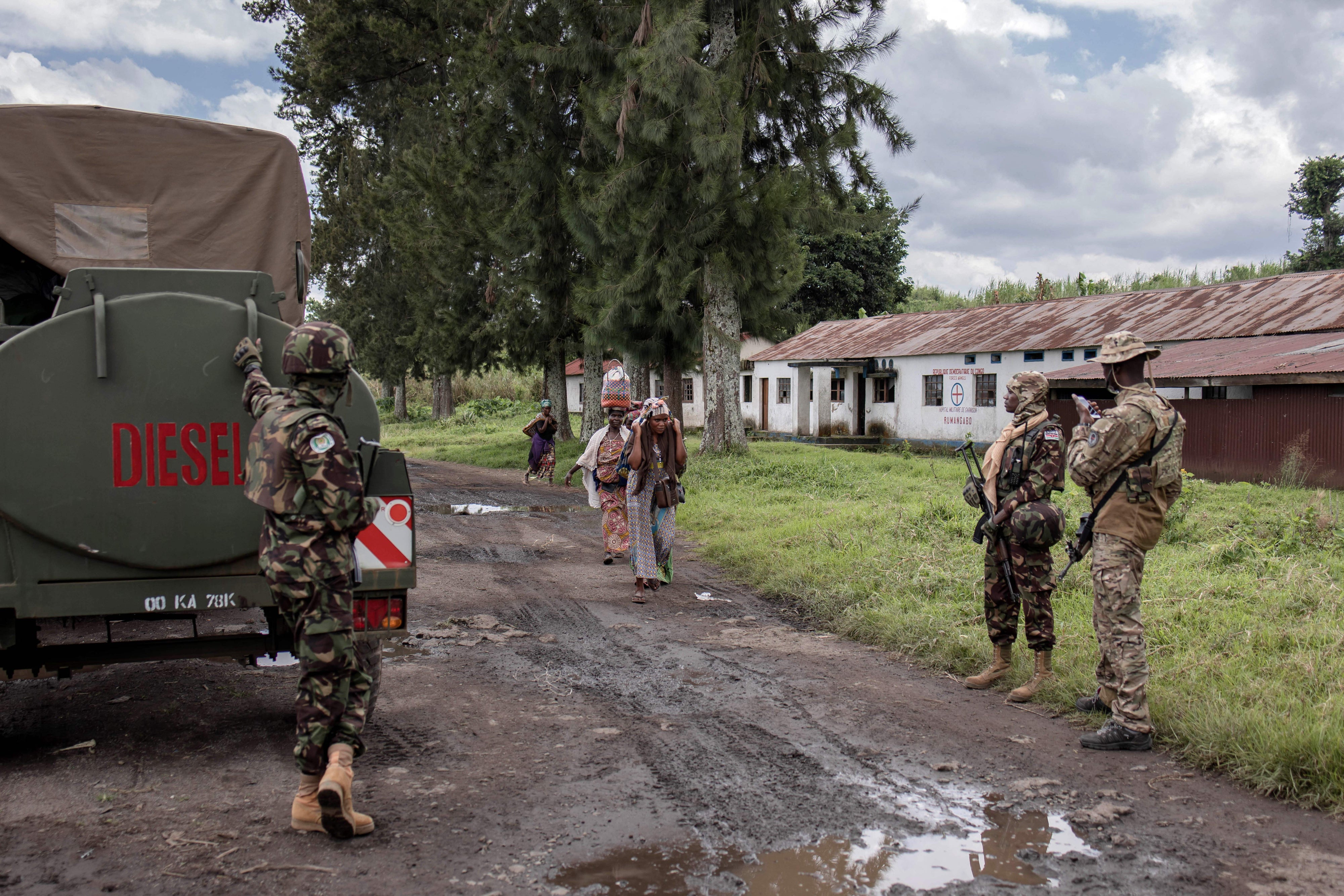 Photograph from January 6, 2023, shows East African Regional Force (EACRF) soldiers guarding Rumangabo camp. The medical center can be seen in the background with a red cross on it.