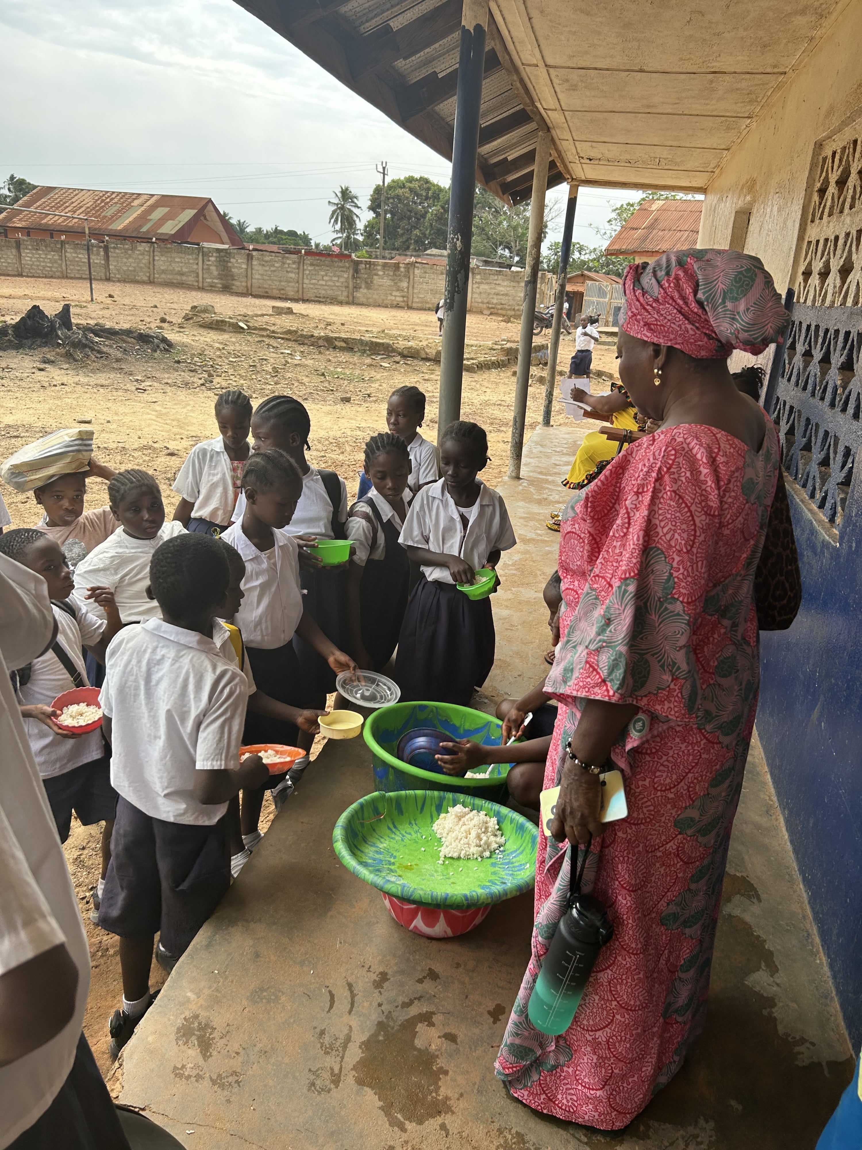 School staff serving children food