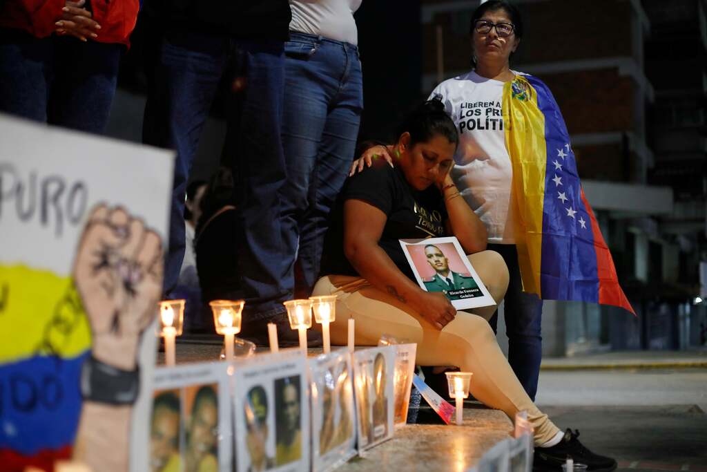 Relatives of detainees held for political reasons wait outside El Helicoide, headquarters of Venezuela's intelligence service and a detention center, after the National Assembly approved an amnesty bill in Caracas, Venezuela, February 19, 2026.