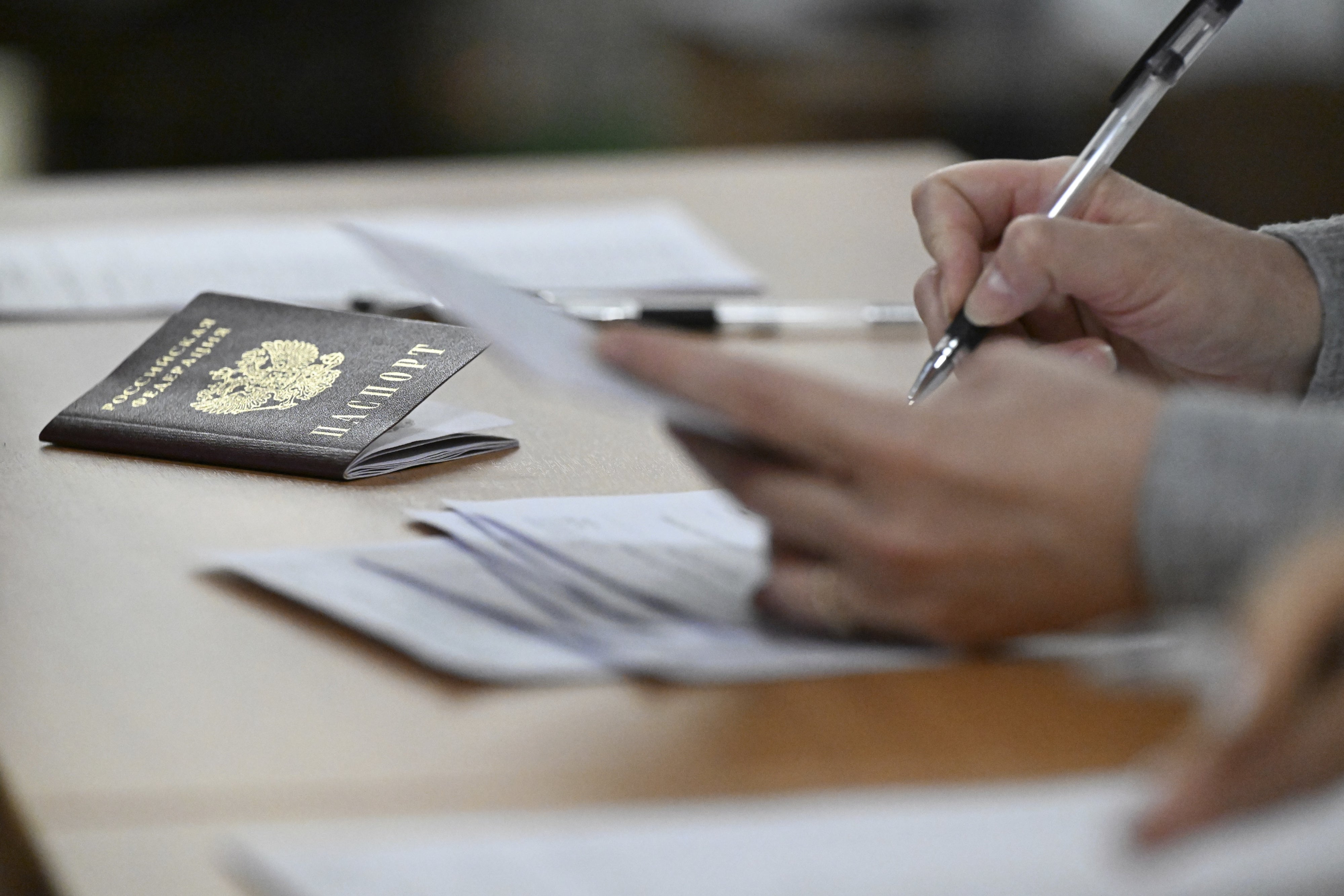 A Russian passport in review in Moscow, March 25, 2025.