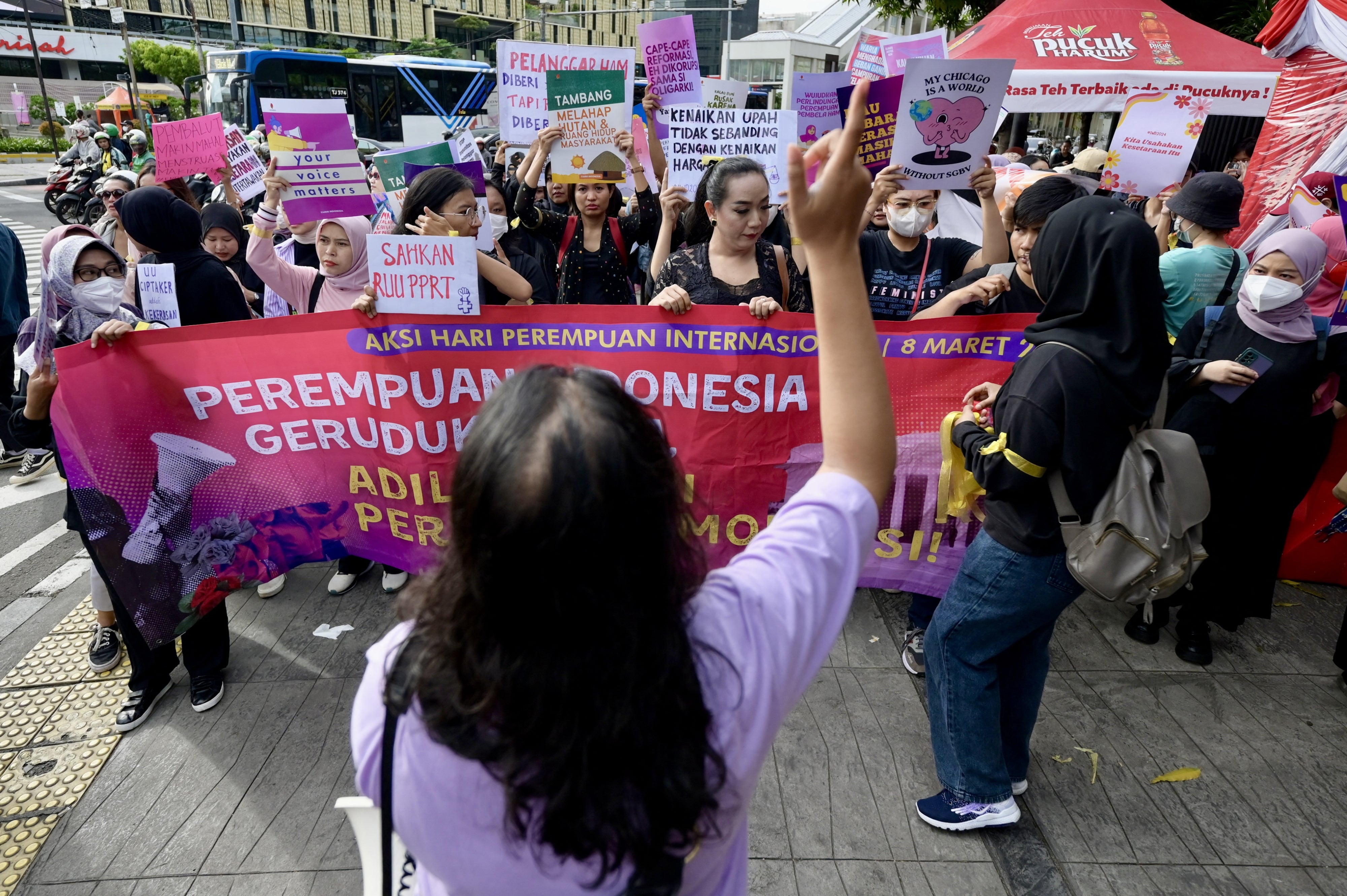 People rally on International Women's Day in Jakarta demanding the Indonesian government pass an anti-discrimination law and ratify the International Labor Organization (ILO) convention concerning the elimination of sexual violence and harassment at work, March 8, 2024.