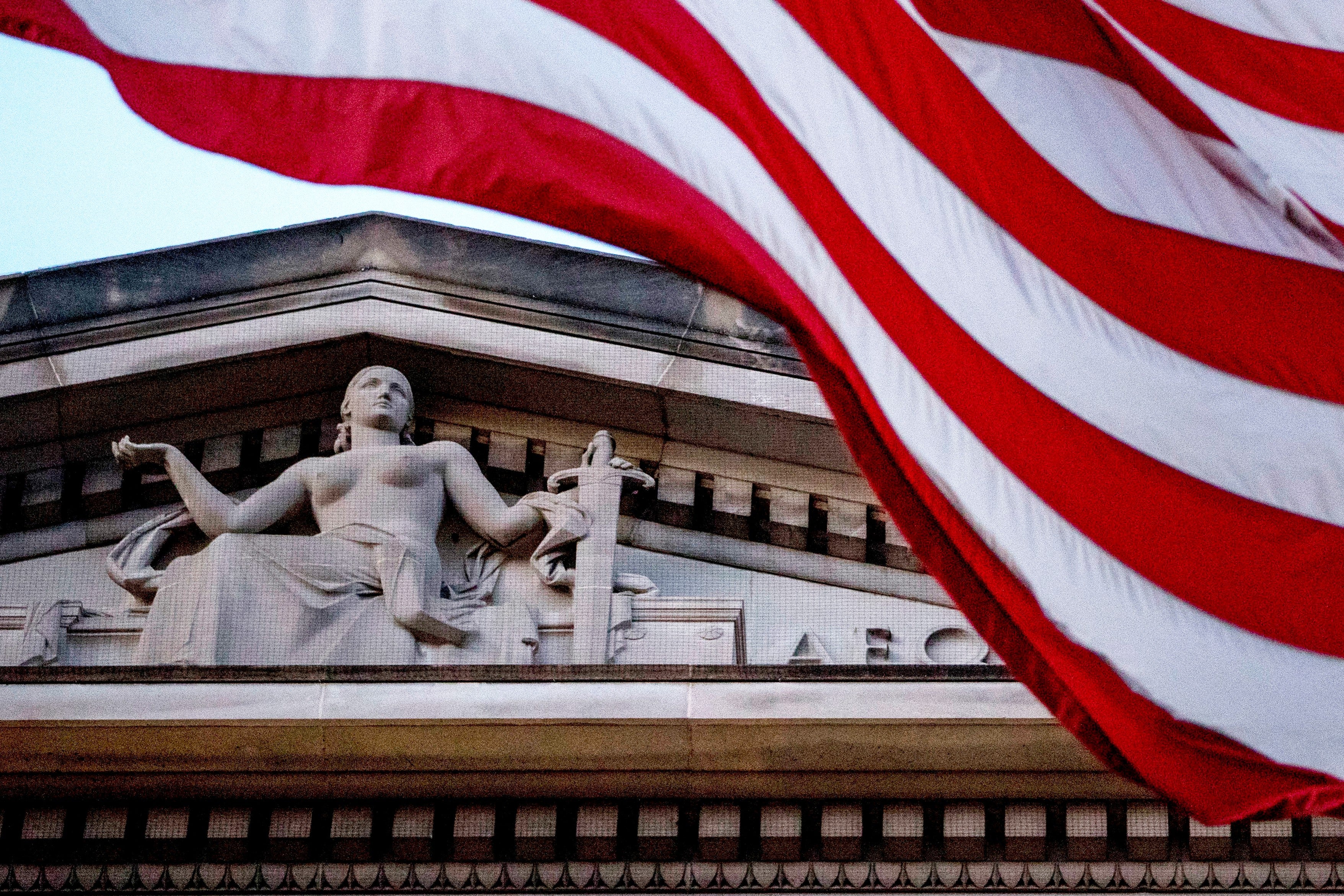 American flag flying outside Department of Justice