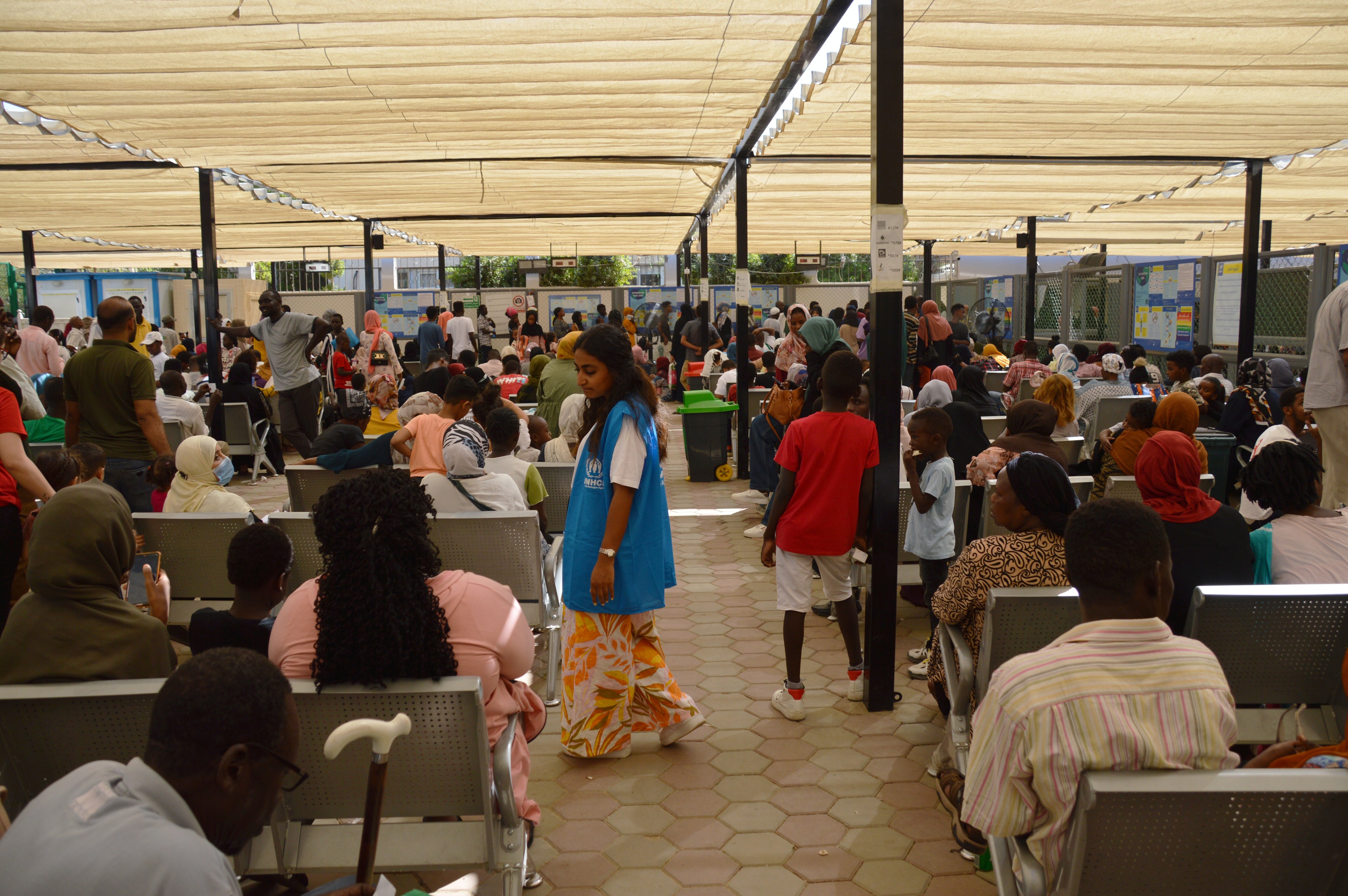 Asylum seekers sit in a UNHCR registration center in Cairo, Egypt on July 25, 2023. 
