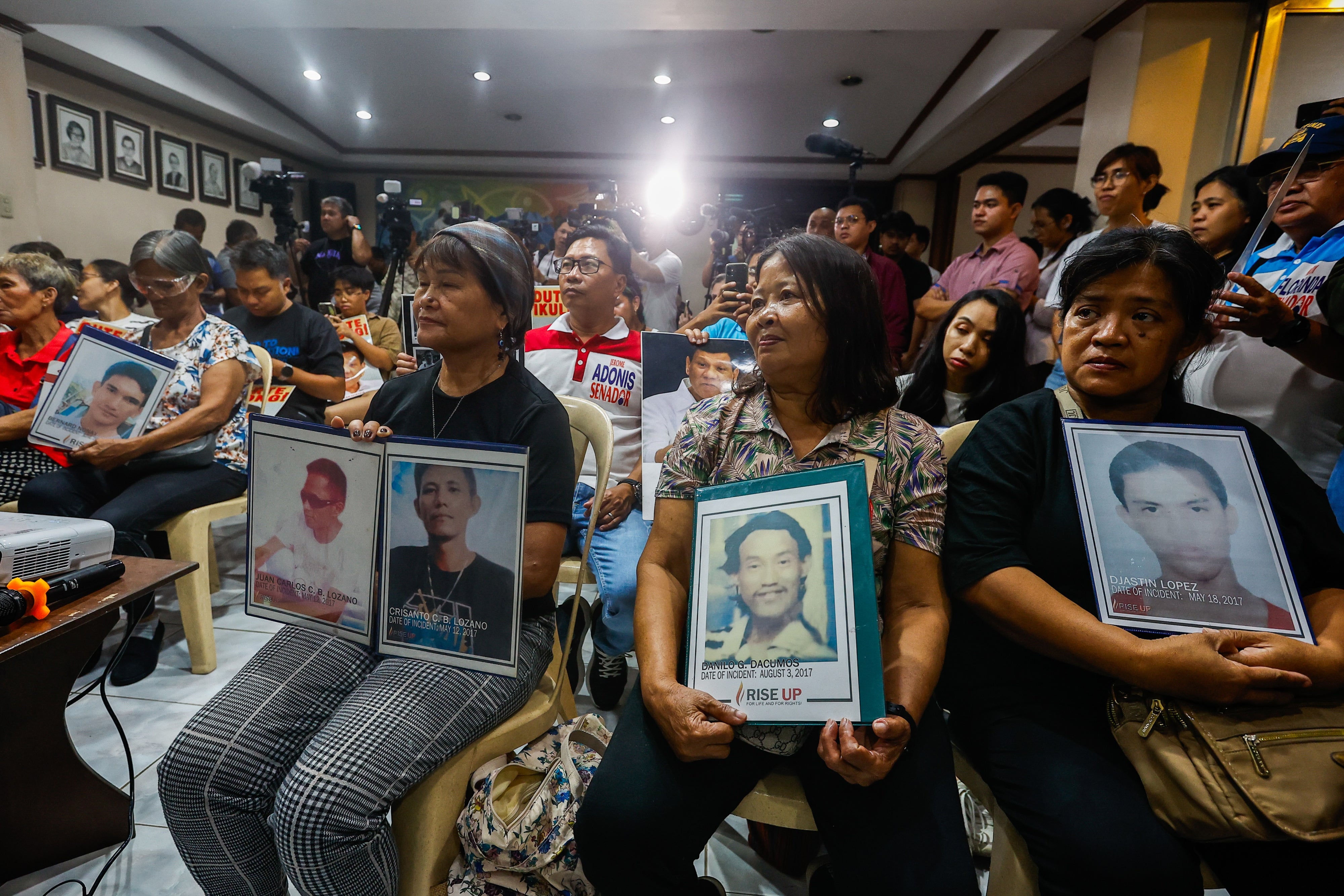 Family members of “drug war” victims watch the livestream of former Philippine President Rodrigo Duterte’s initial appearance at the International Criminal Court for alleged crimes against humanity, in Quezon City, Philippines, March 14, 2025. 