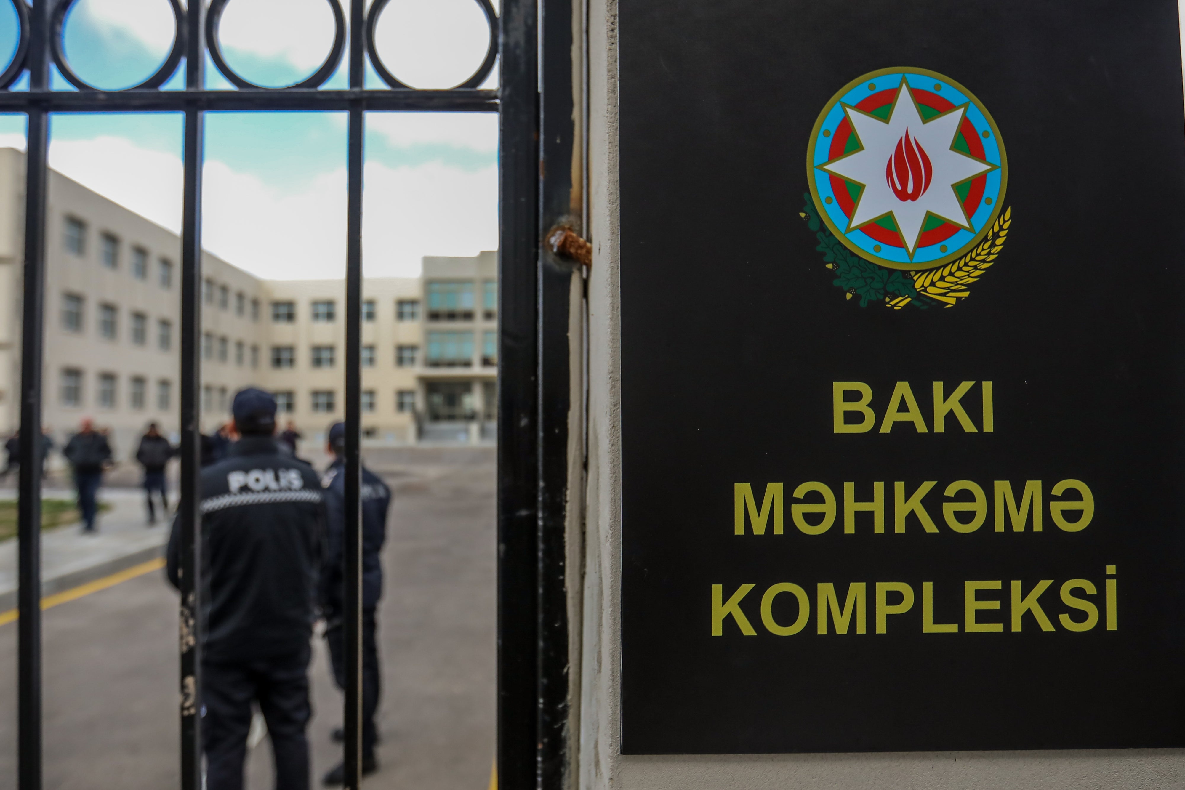 Police officers stand outside a courthouse on January 21, 2025, in Baku, Azerbaijan. 