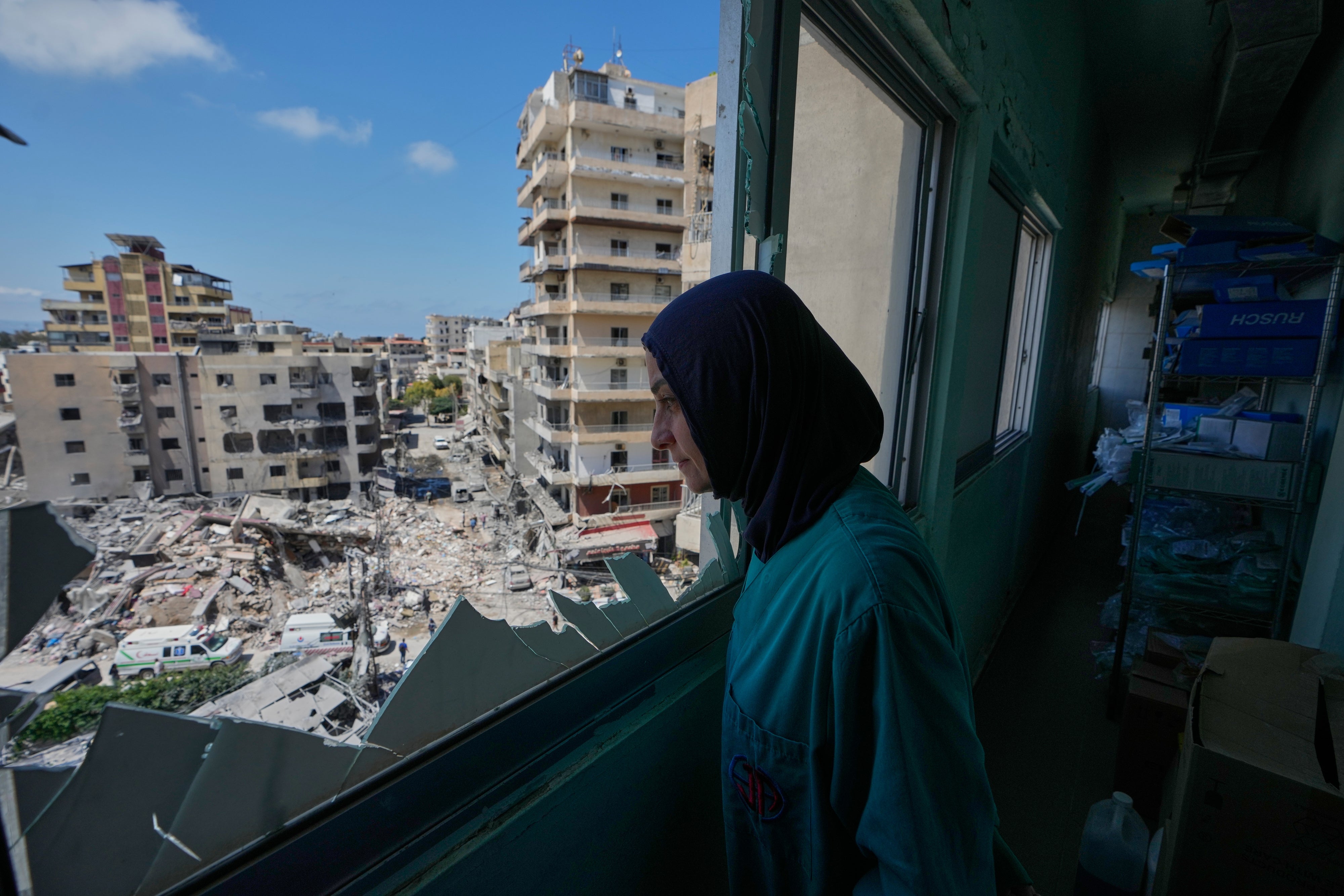 A nurse looks out of the Jabal Amel Hospital at areas struck during an Israeli airstrike in the southern port city of Tyre, Lebanon, June 2, 2026.
