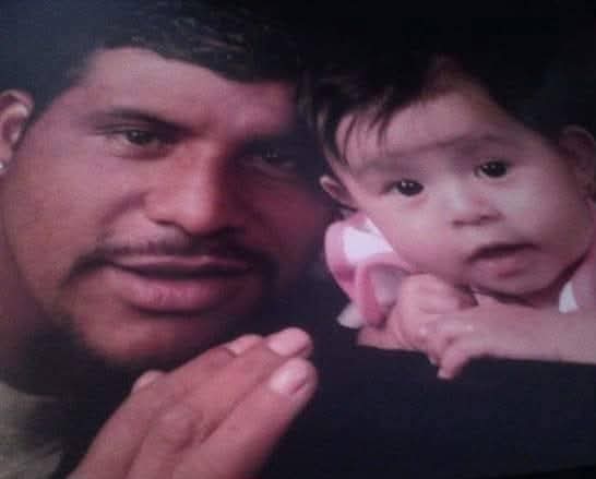A man posing for a photo with his daughter