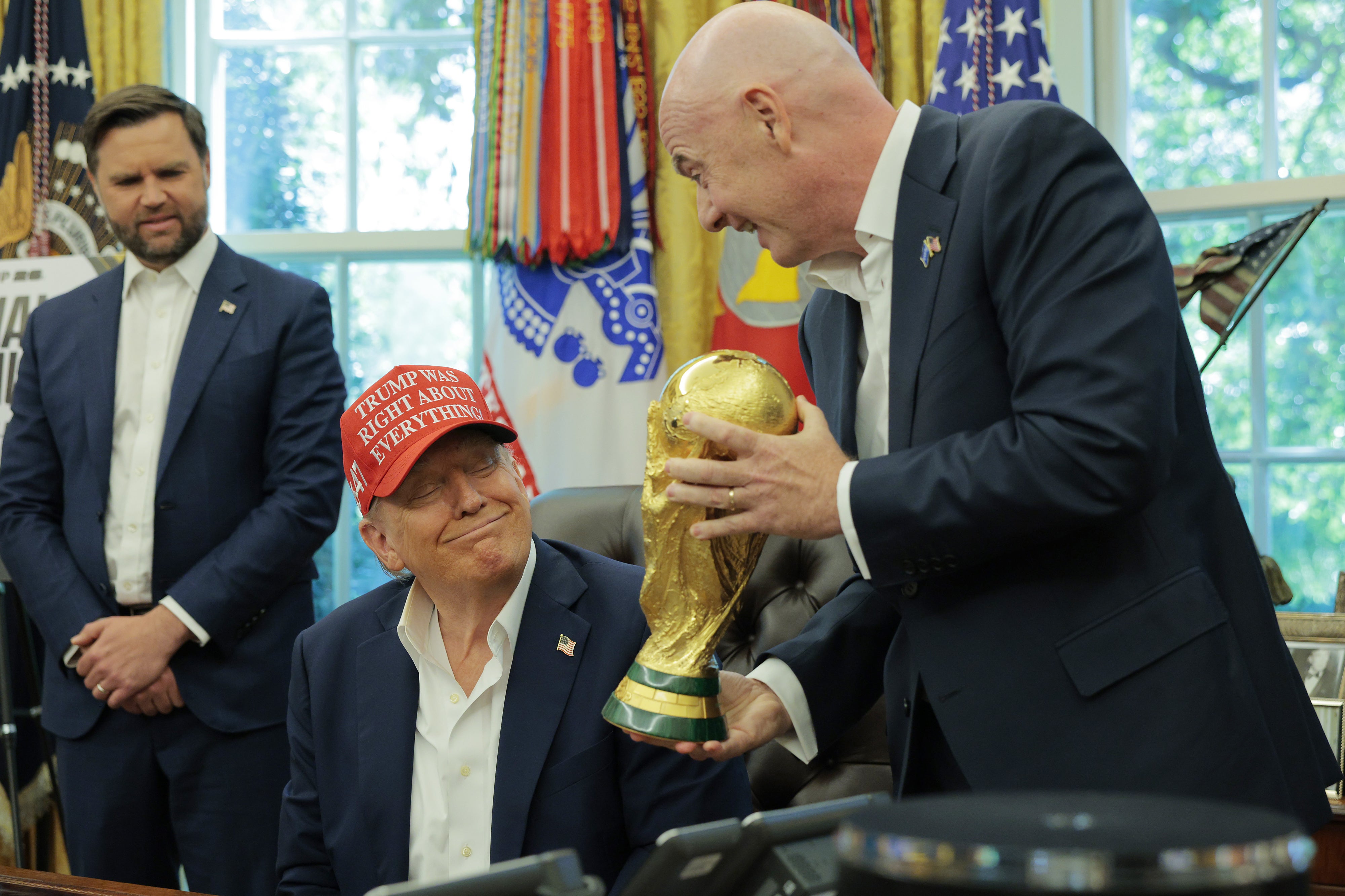 Infantino is seen showing Trump the World Cup Trophy in the white house.
