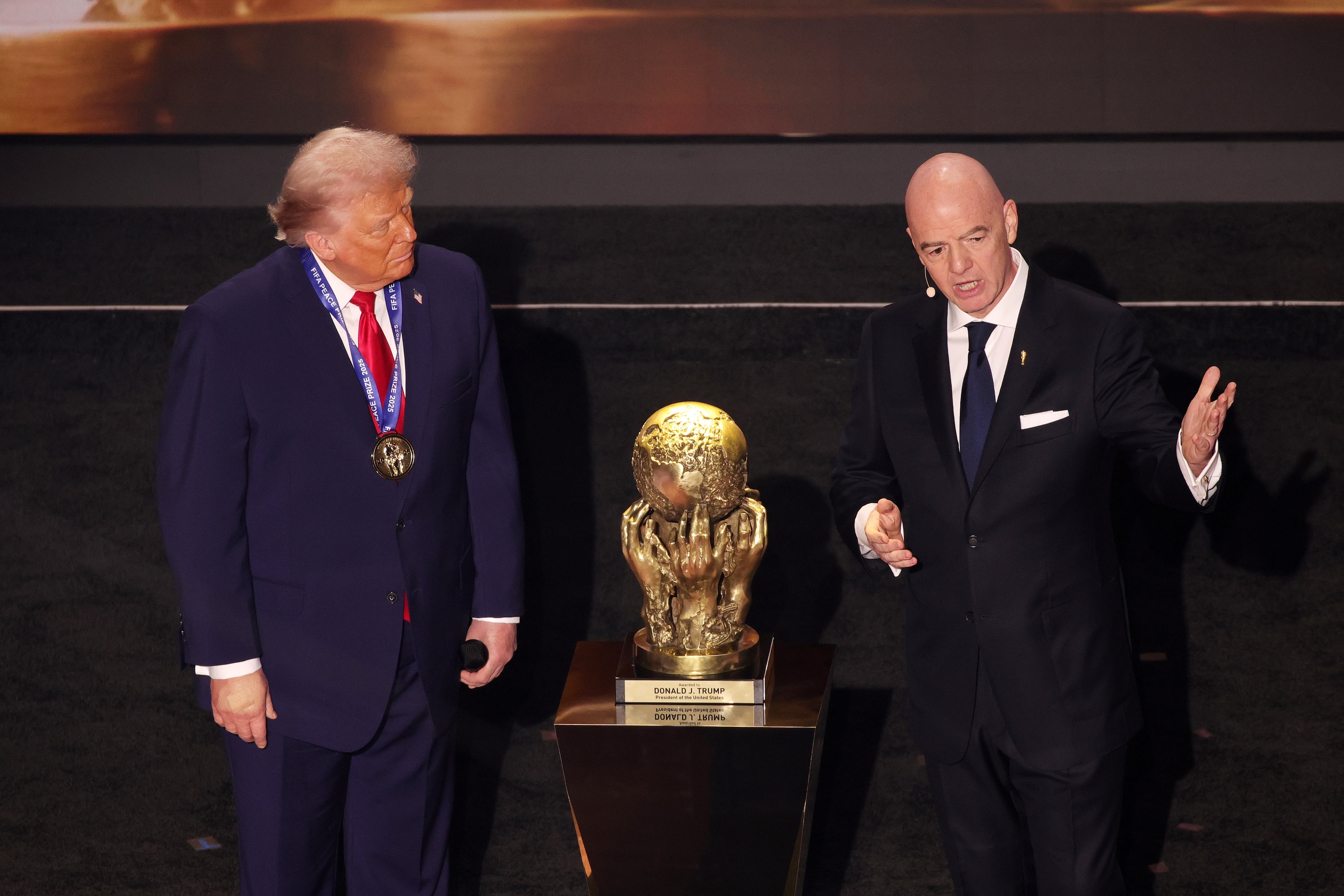 US President Donald Trump is presented with the inaugural FIFA Peace Prize award by FIFA President Gianni Infantino, January 9, 2026.