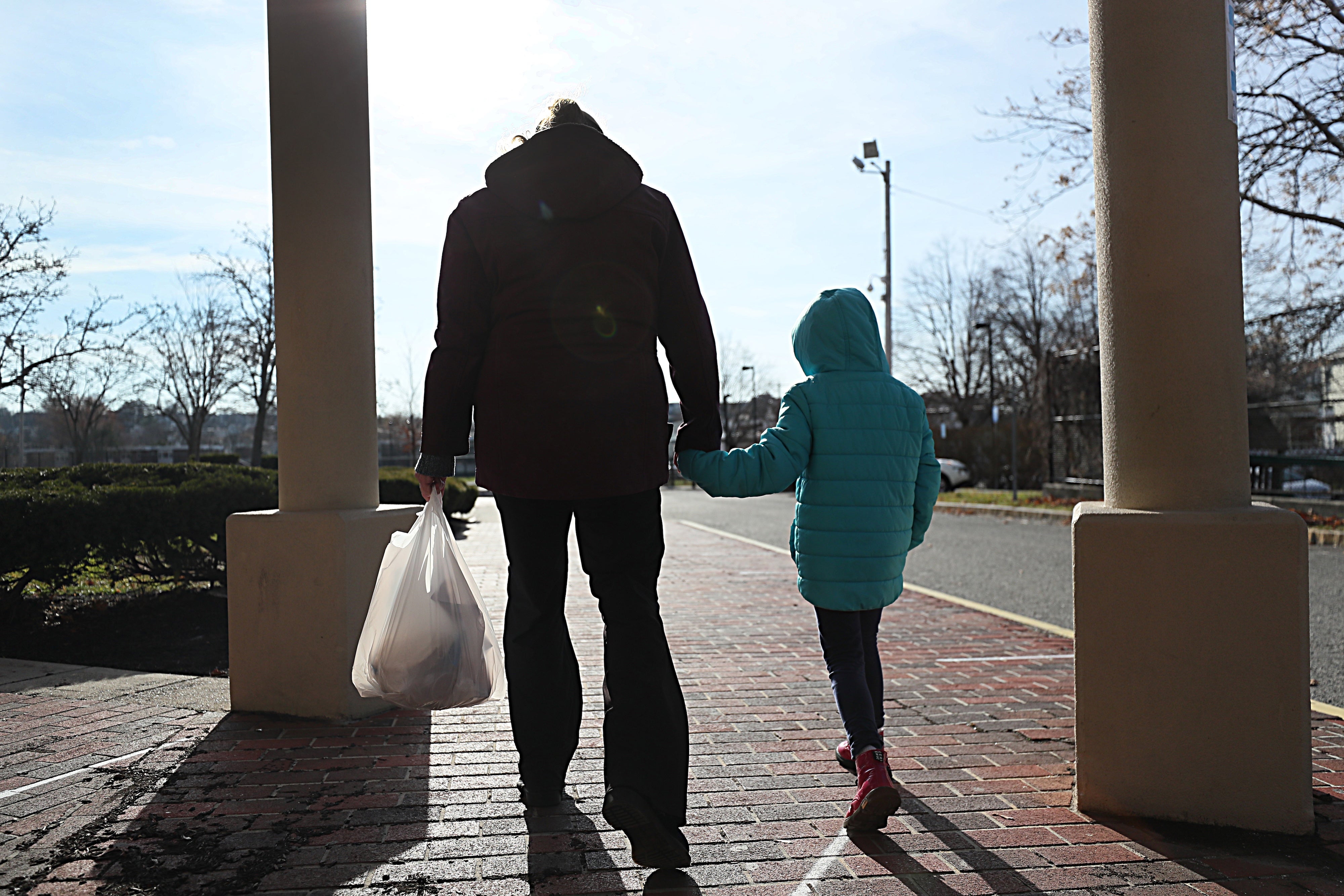 A woman and her daughter in Revere, Massachusetts, US, December 11, 2020.