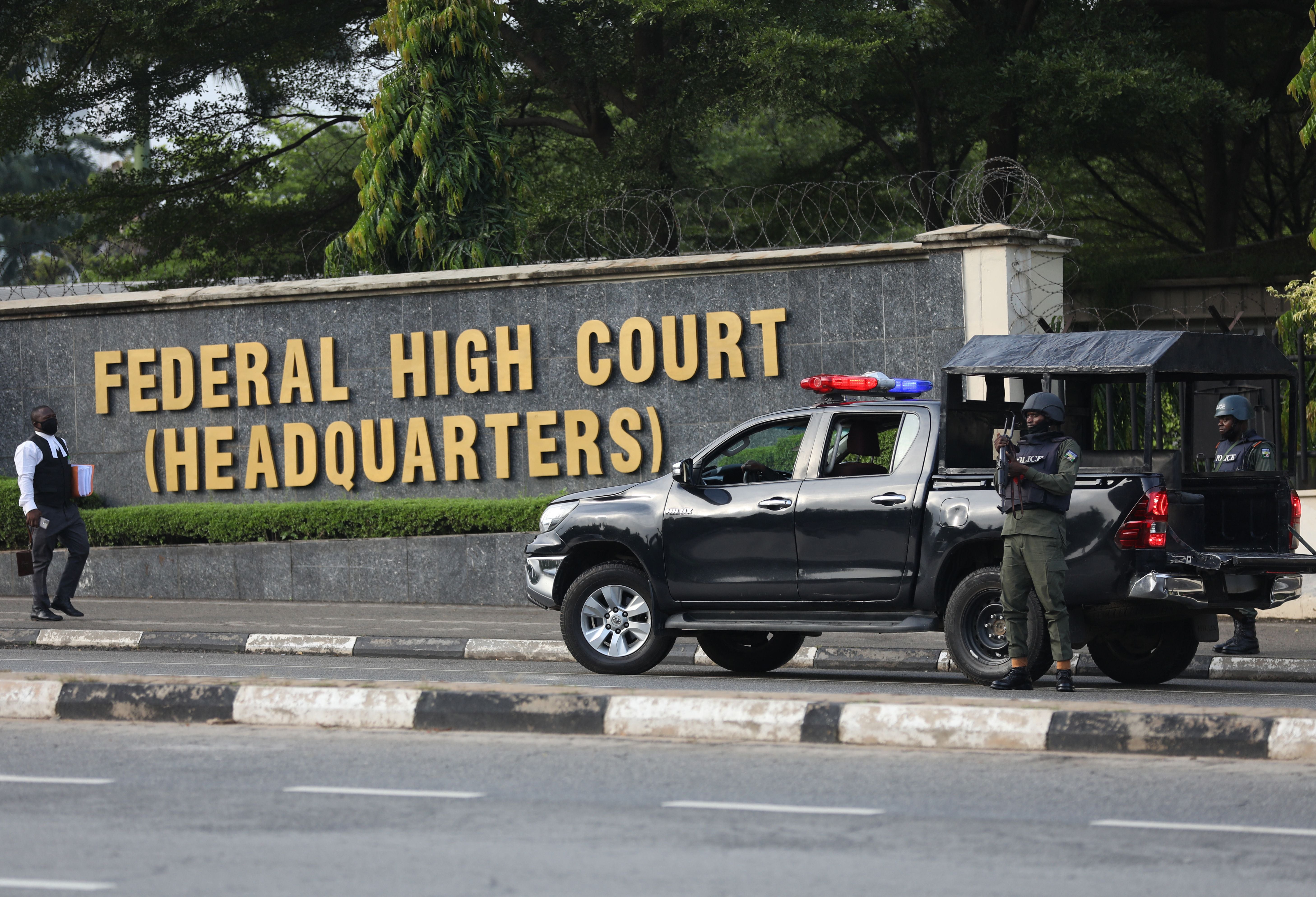 Members of the Nigerian police force are seen outside the Federal High Court, in Abuja, Nigeria, on October 21, 2021.