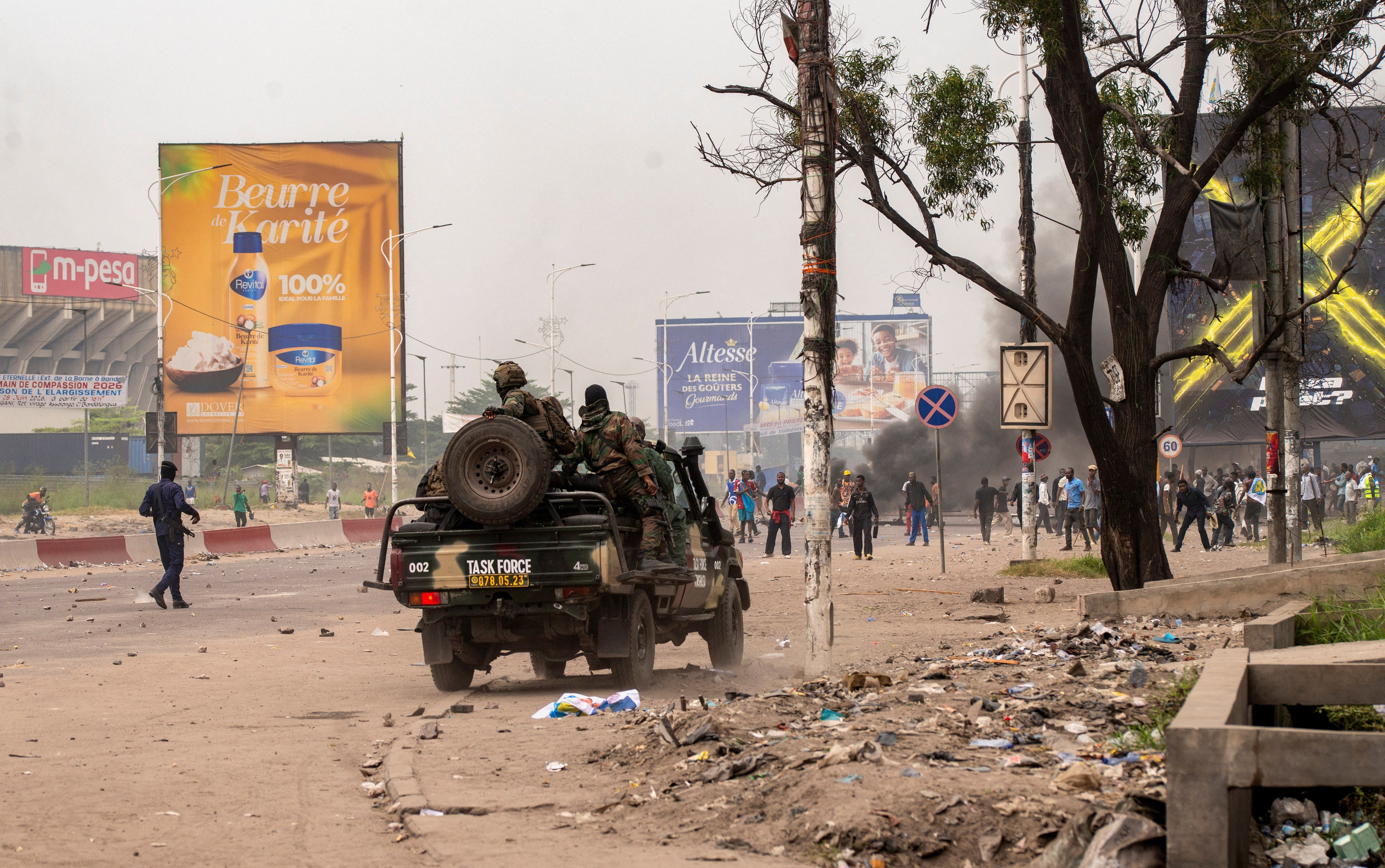 Security forces disperse protesters near the parliament building in Kinshasa, Democratic Republic of Congo, June 12, 2026.
