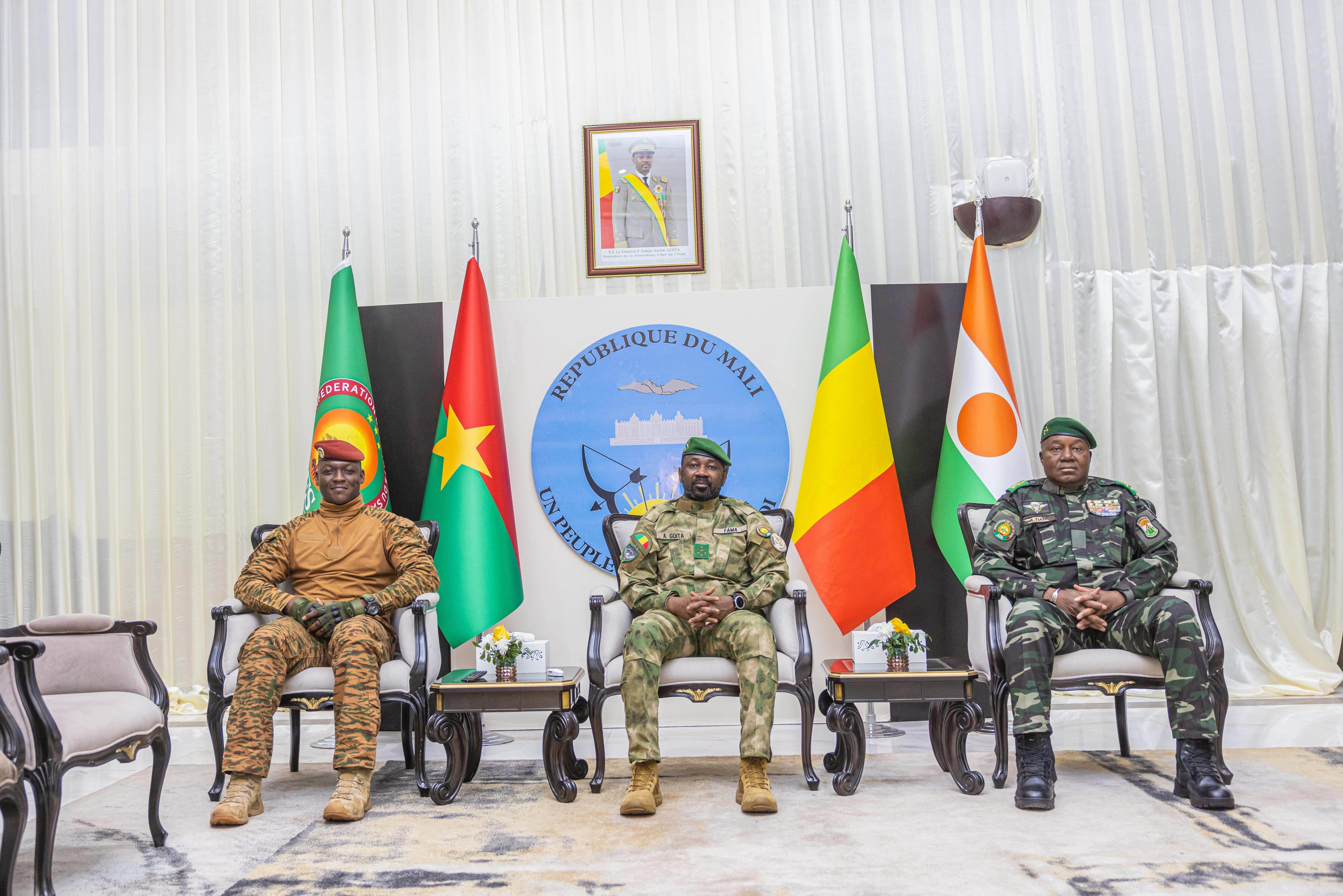Capt. Ibrahim Traoré of Burkina Faso (left), Gen. Assimi Goita of Mali (center), and Gen. Abdourahamane Tchiani of Niger attend the second summit on security and development in Bamako, Mali, December 23, 2025. 