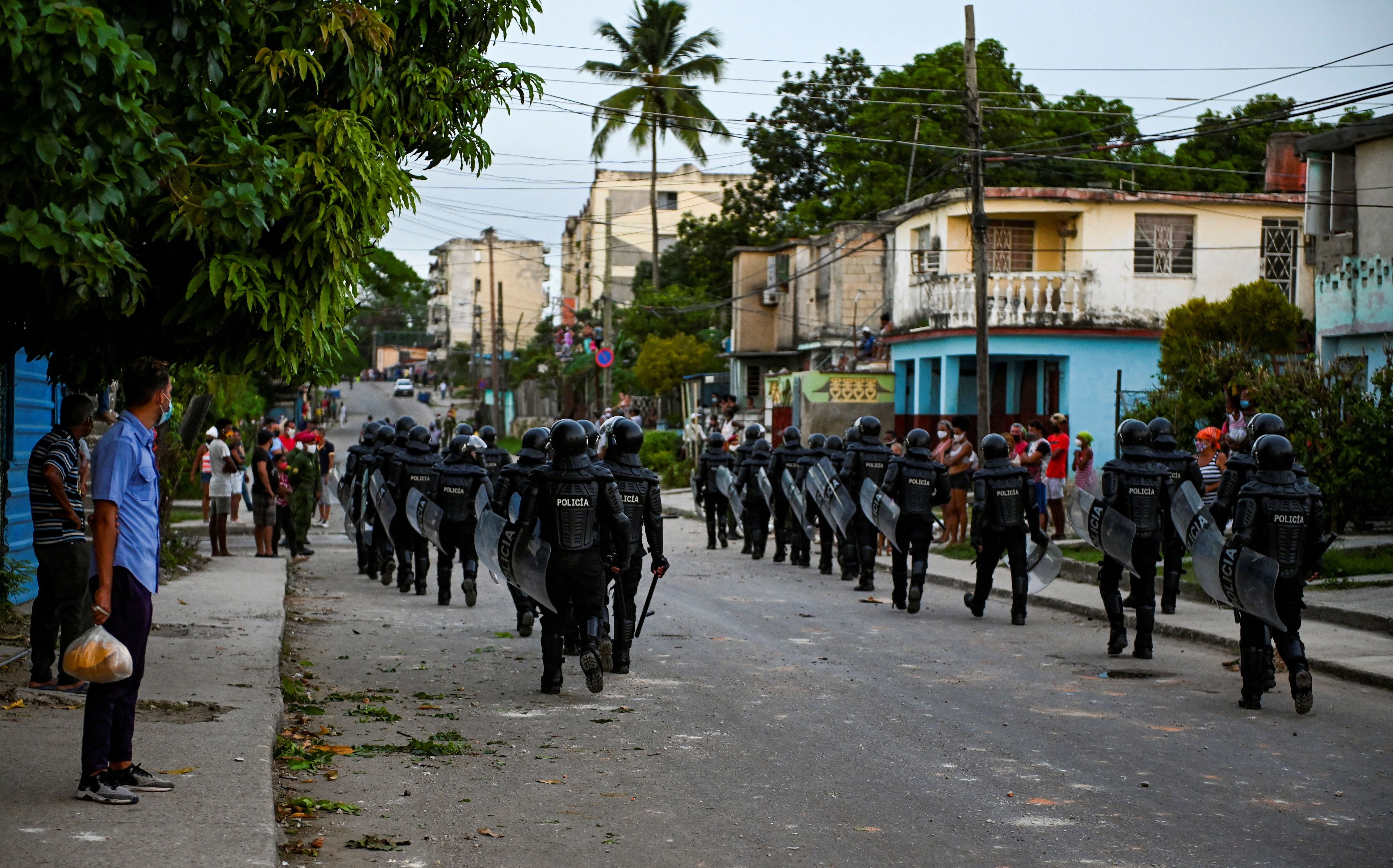 Riot police walk the streets after a demonstration against the government of President Miguel Diaz-Canel in Arroyo Naranjo Municipality, Havana, Cuba, on July 12, 2021.