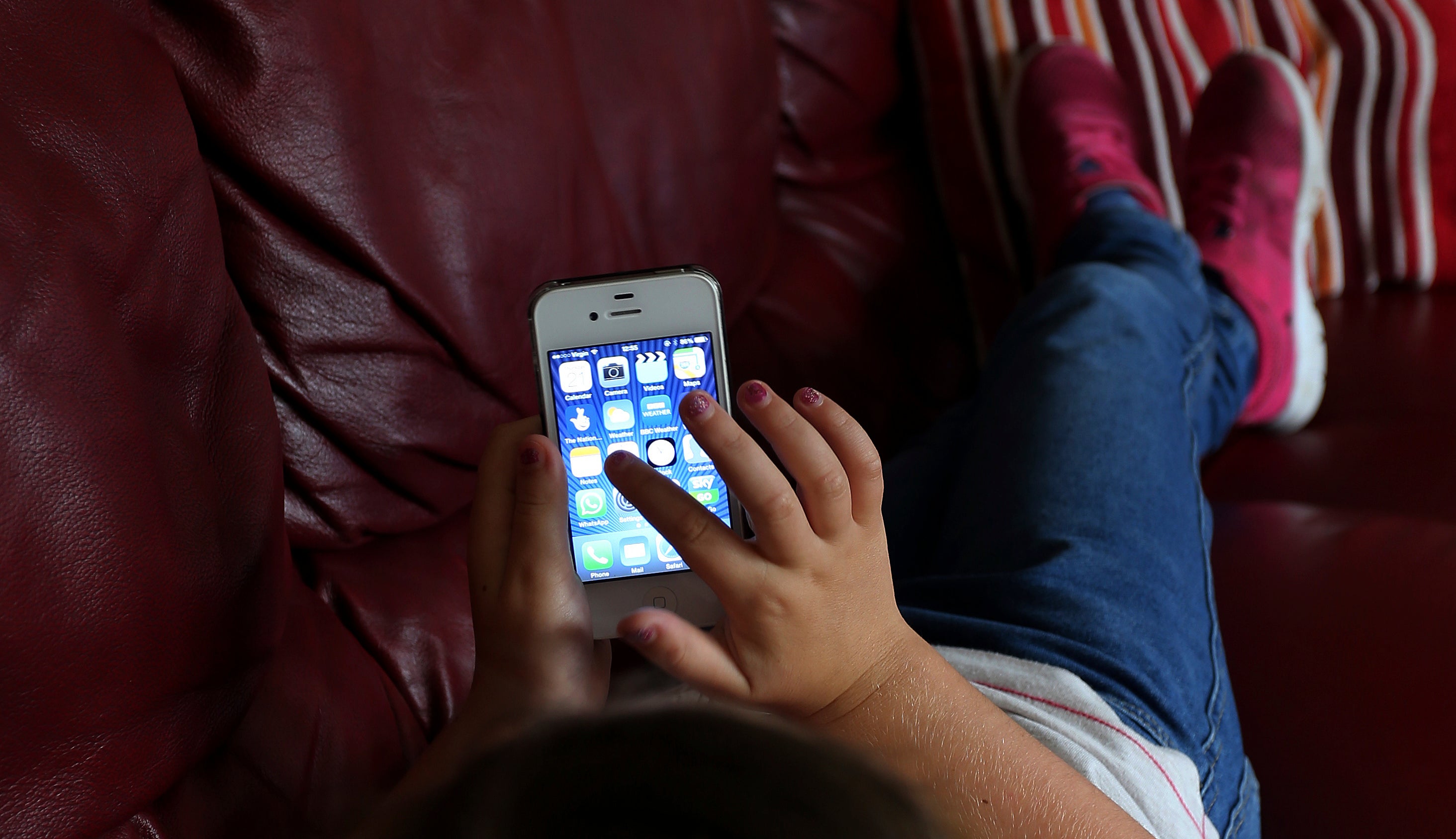 A child using a cellphone.