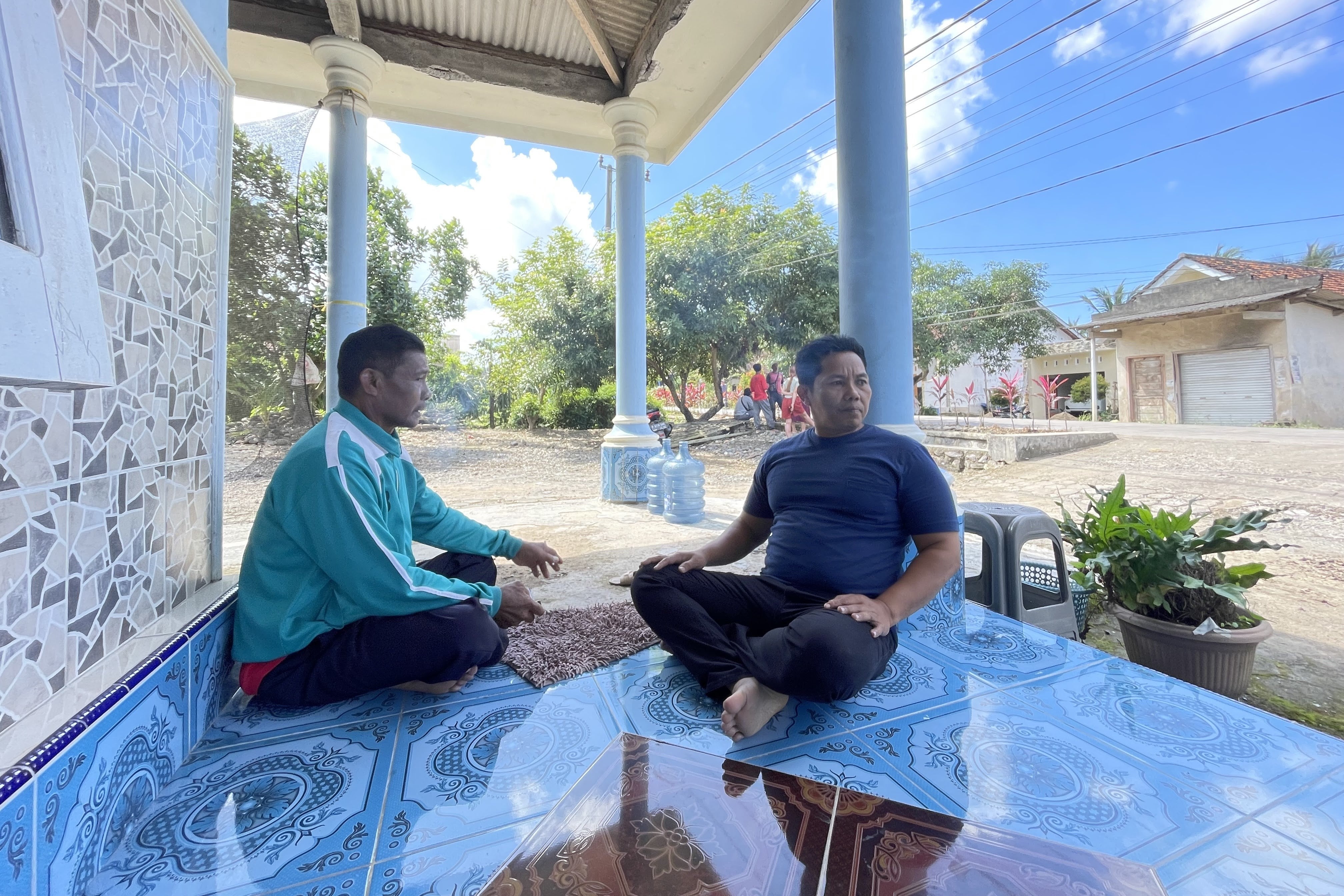 Two men seated 