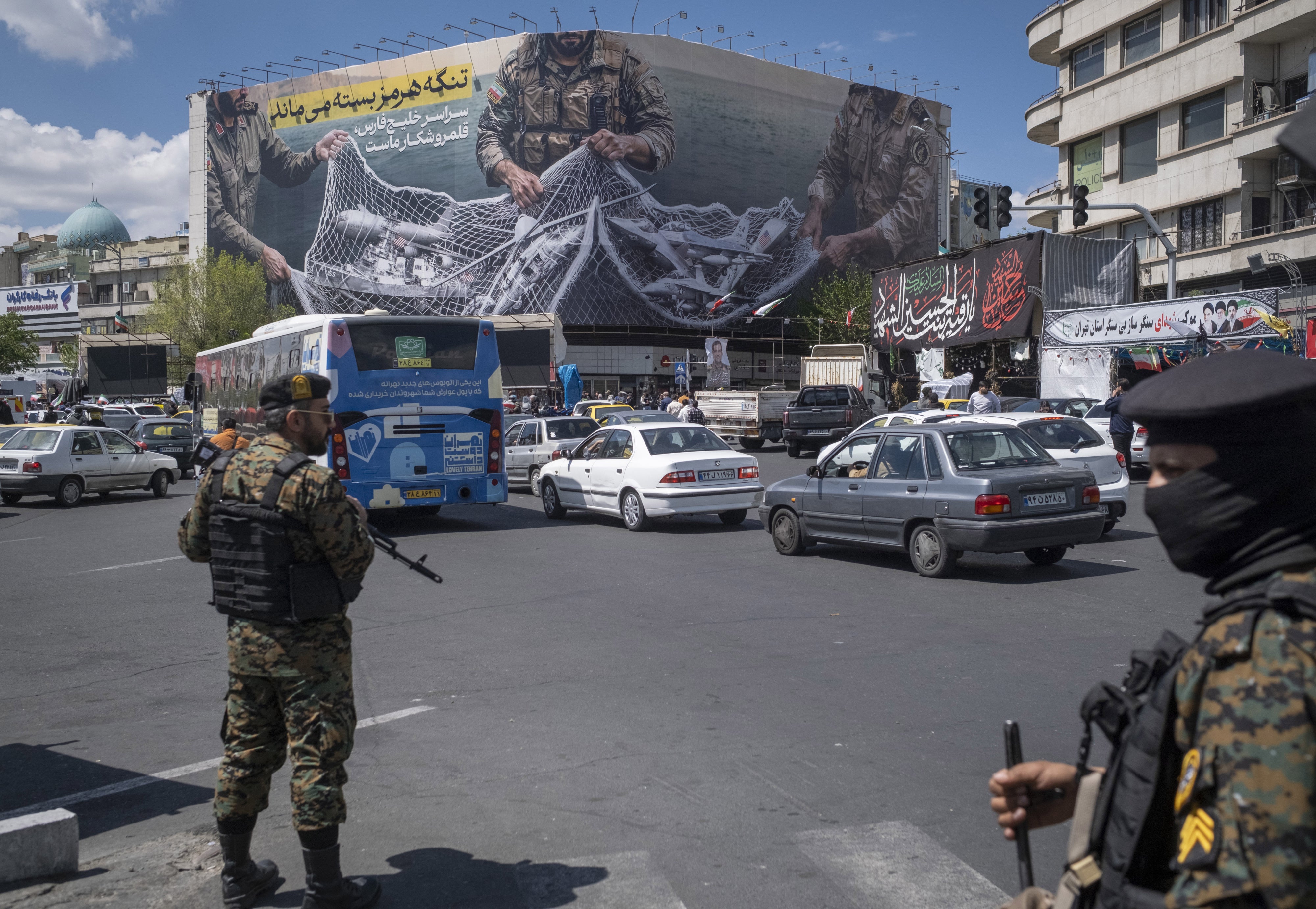 Two members of Iran’s security forces stand guard in downtown Tehran, Iran, on April 8, 2026.
