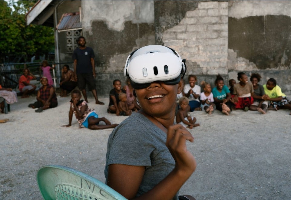 A resident of the Ngongosila community in Malaita Province, Solomon Islands views Virtual Reality content during a demo session.
