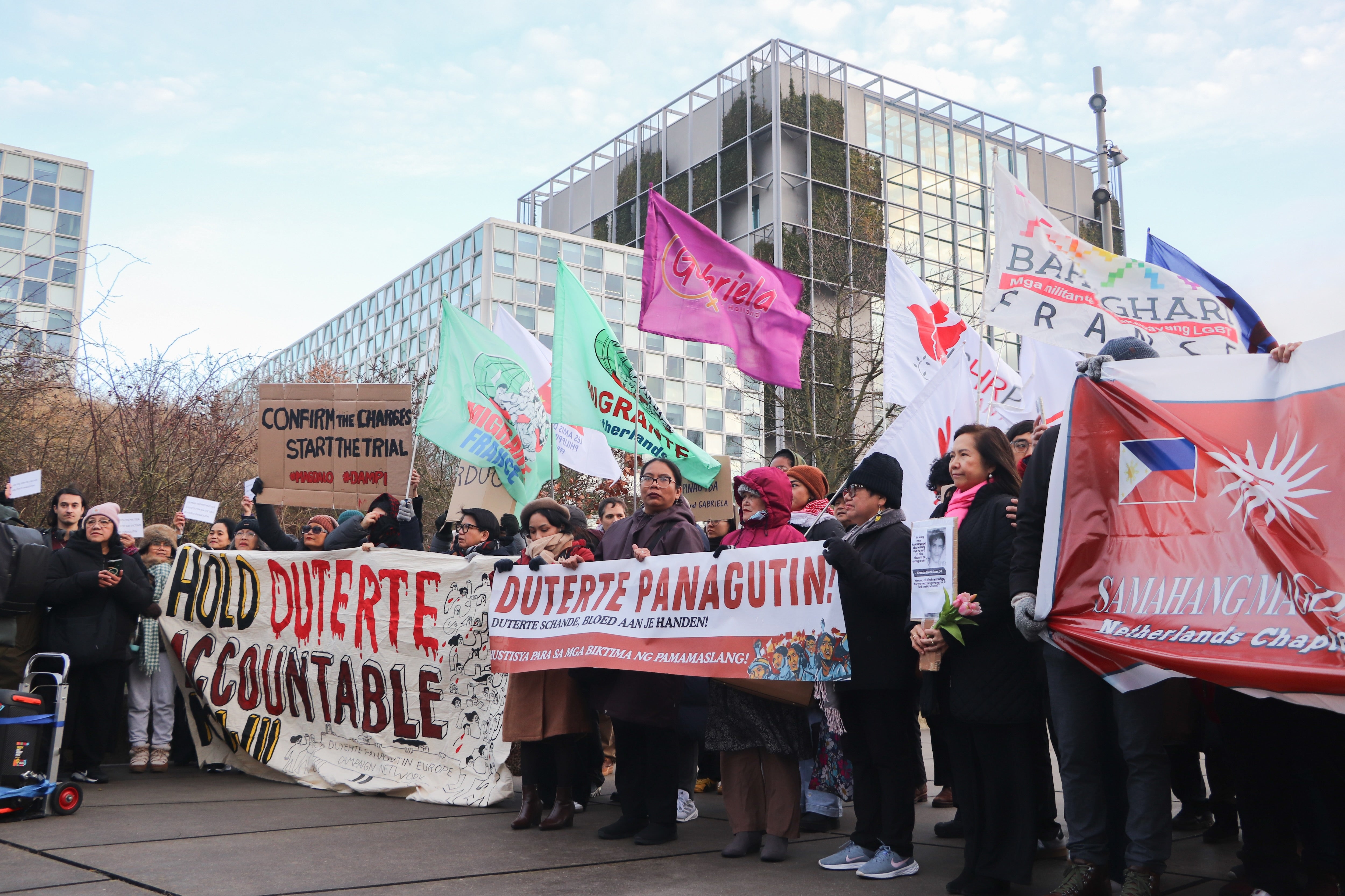 Victims’ families and activists gather outside the International Criminal Court in The Hague to demand justice for the thousands of people killed during the abusive “drug war” of former Philippine President Rodrigo Duterte, February 23, 2026.