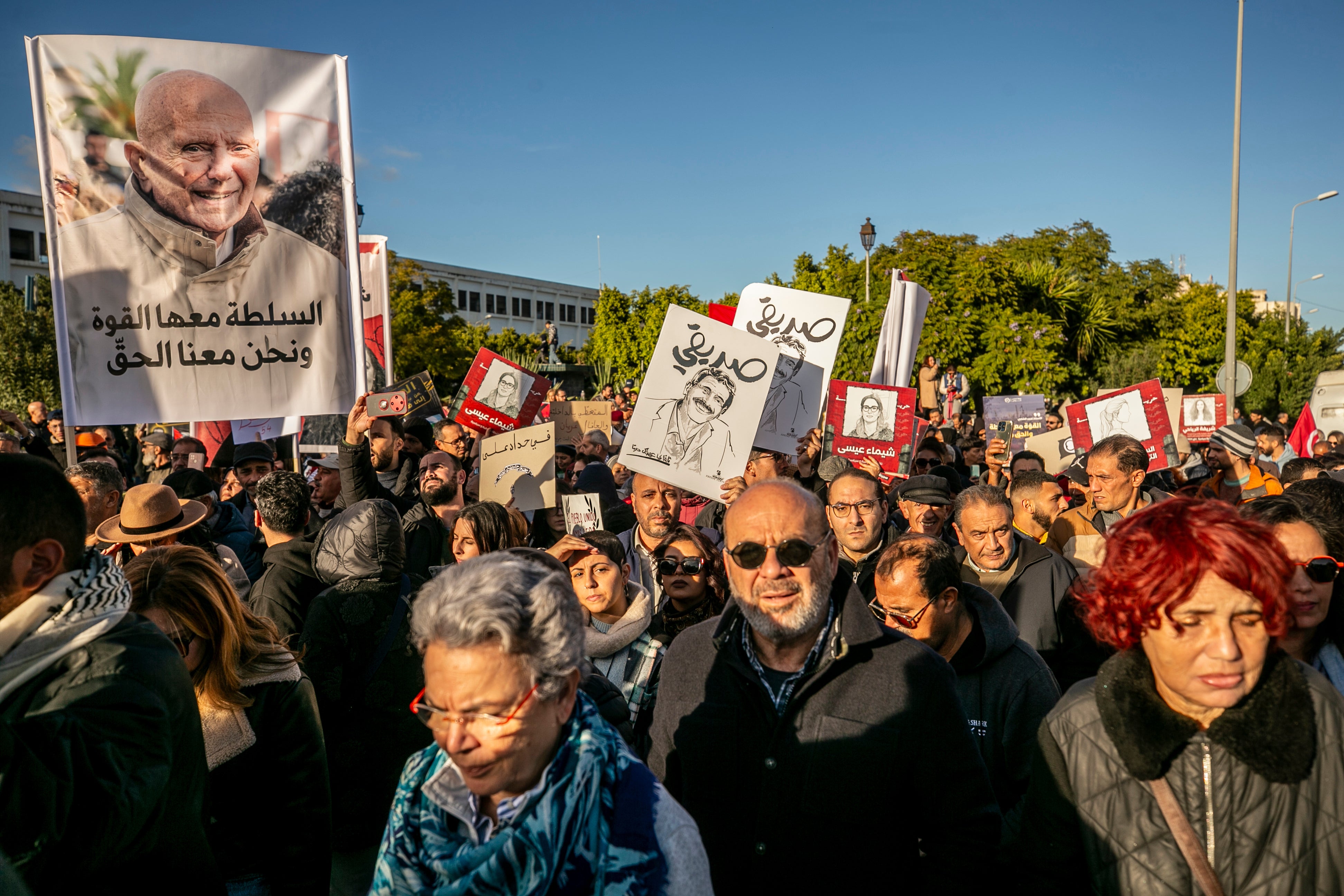 People rally calling for the release of political detainees and greater freedom of expression in Tunis, Tunisia, on December 6, 2025.