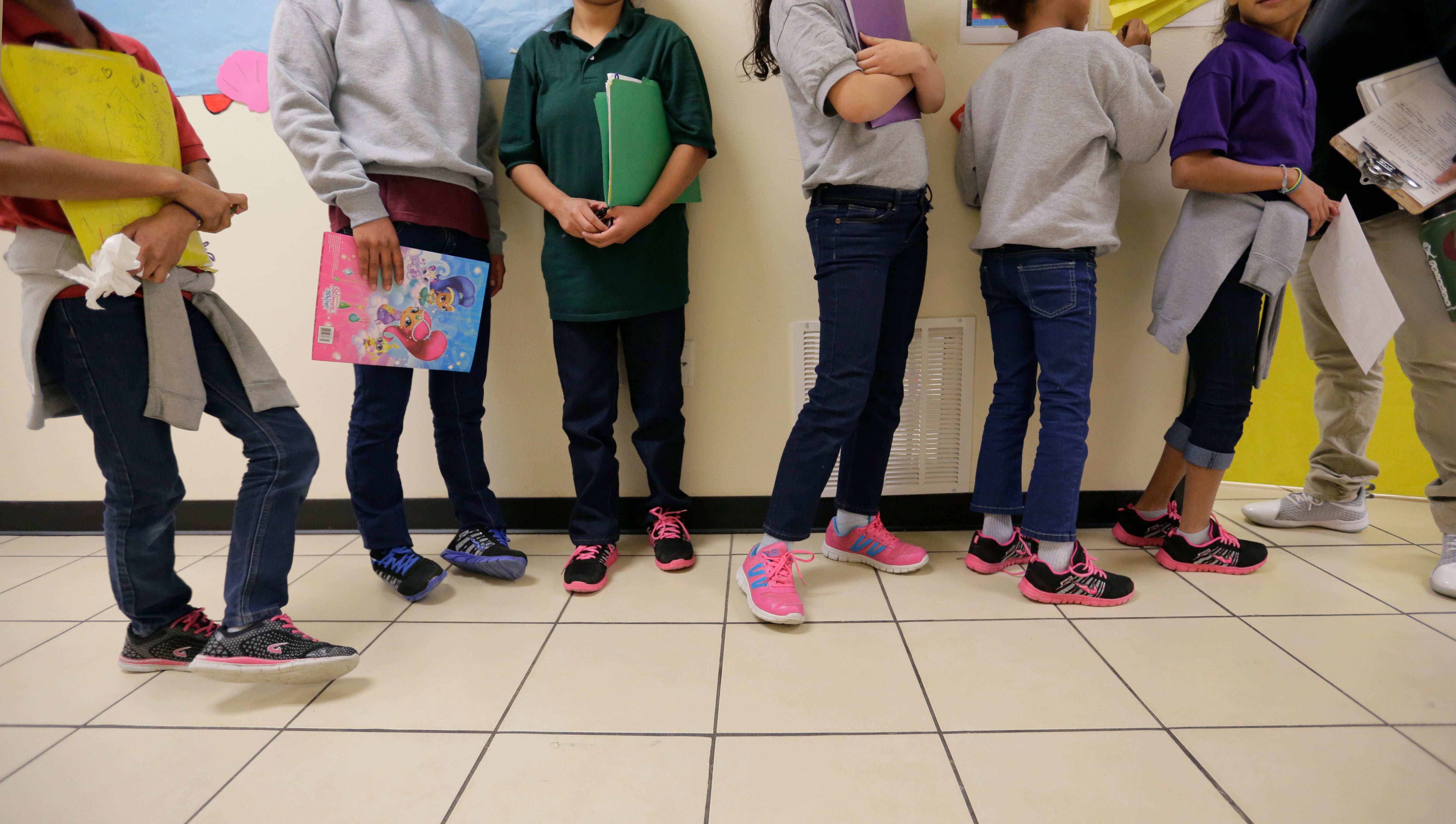 Migrant teens line up for a class in San Benito, Texas, in August 29, 2019.