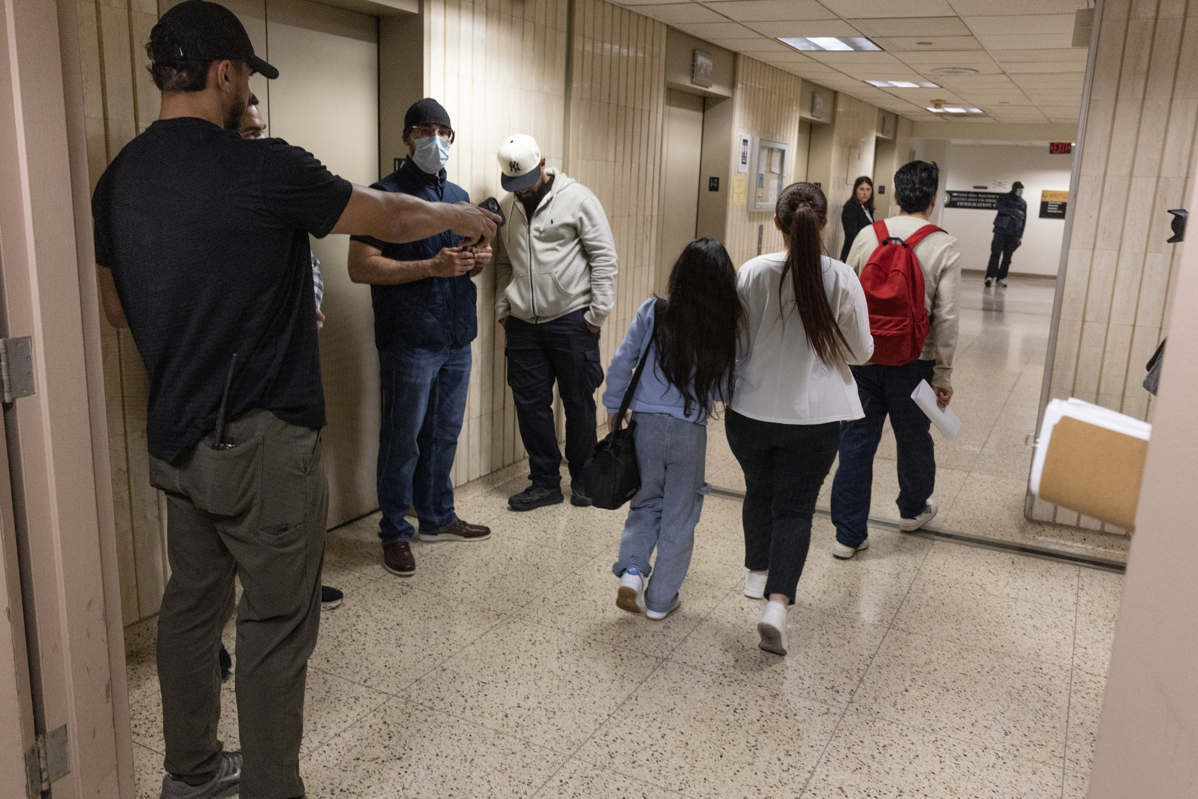 Plainclothes Immigration and Customs Enforcement (ICE) officers detain an immigrant leaving their scheduled court appearance at a Federal immigration court in New York City, June 4, 2025.