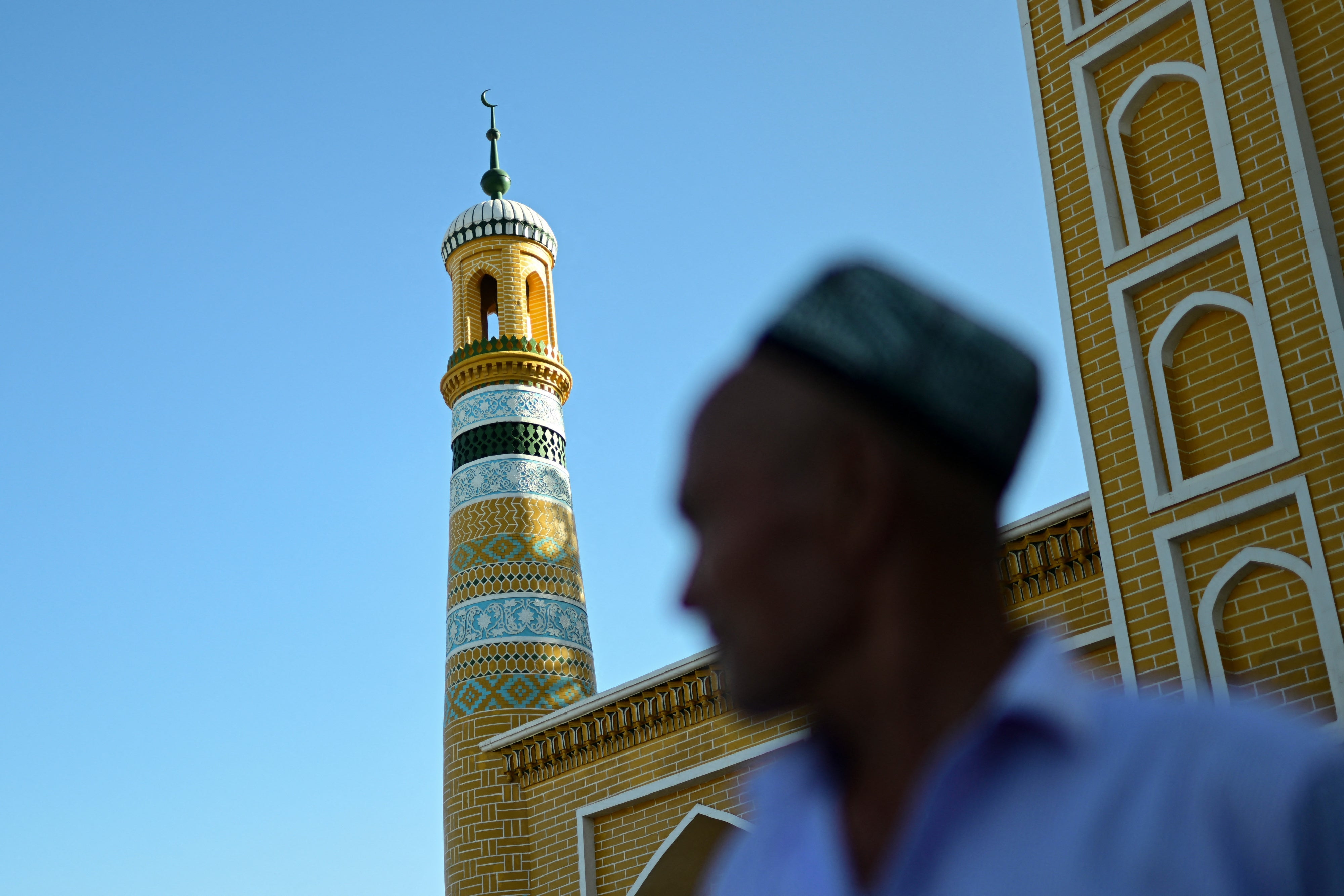A Uyghur man outside of the Id Kah Mosque in Kashgar city in northwestern China's Xinjiang region, July 13, 2023. 