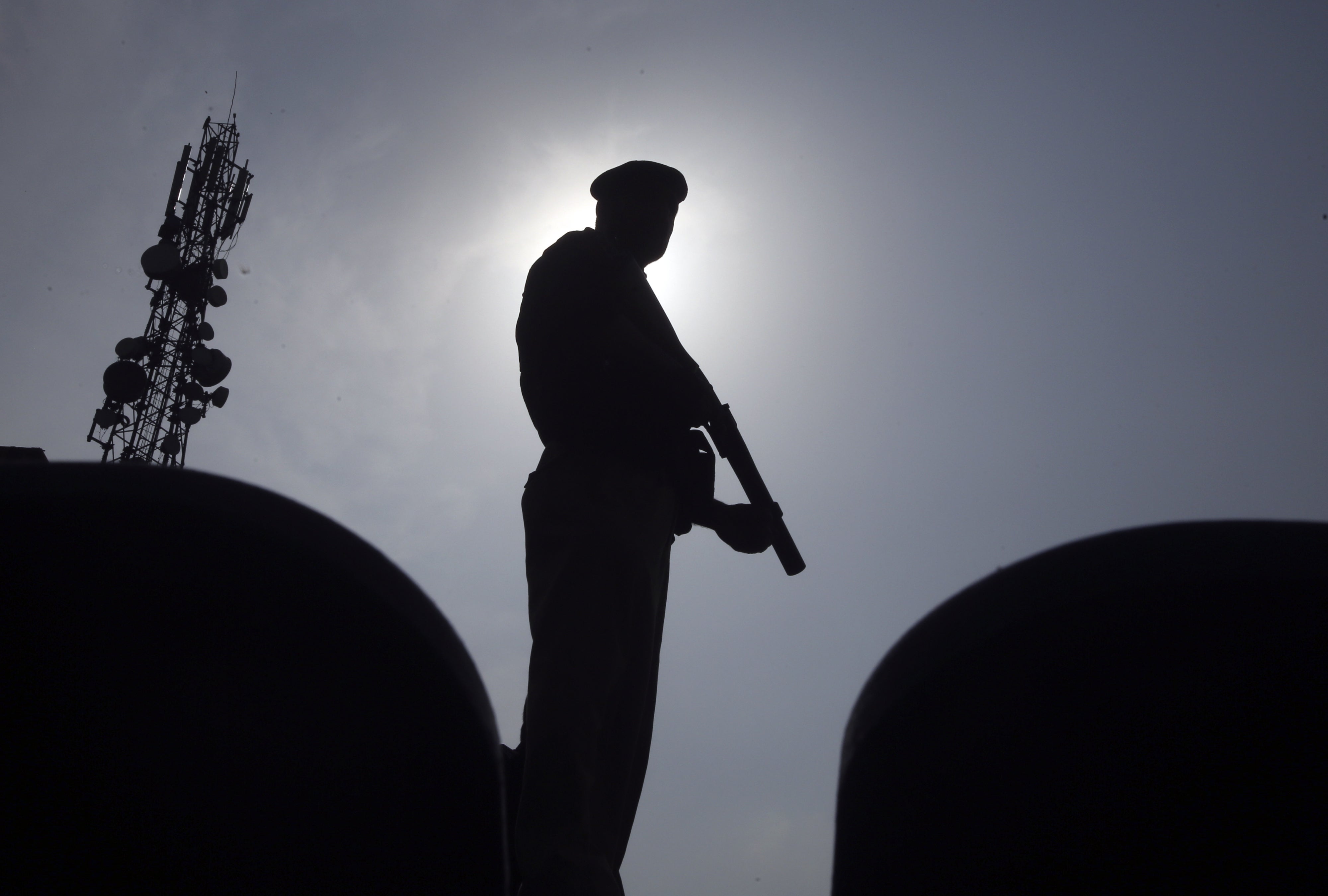 A police officer stands guard in Peshawar, Pakistan, August 5, 2023.