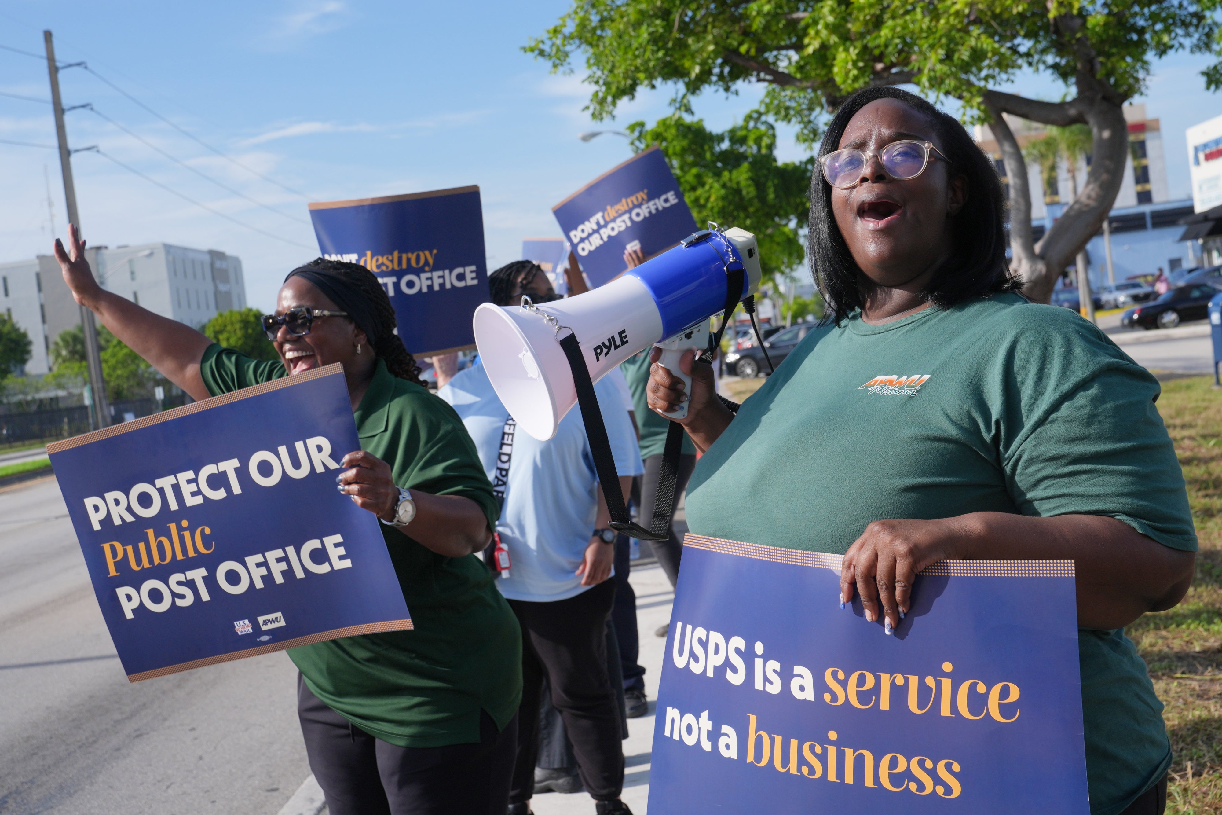 People demonstrate against proposed changes to the US Postal Service and President Donald Trump's executive order regarding mail-in ballots, Miami, Florida, July 28, 2026. 