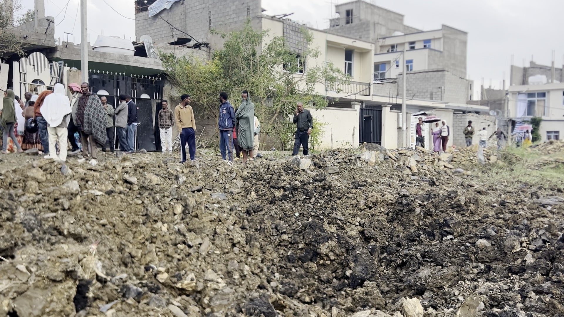 A large crater caused by an air-dropped munition in the courtyard of a residential compound in Daero neighborhood, Mekelle, Tigray region, Ethiopia, August 20, 2026.