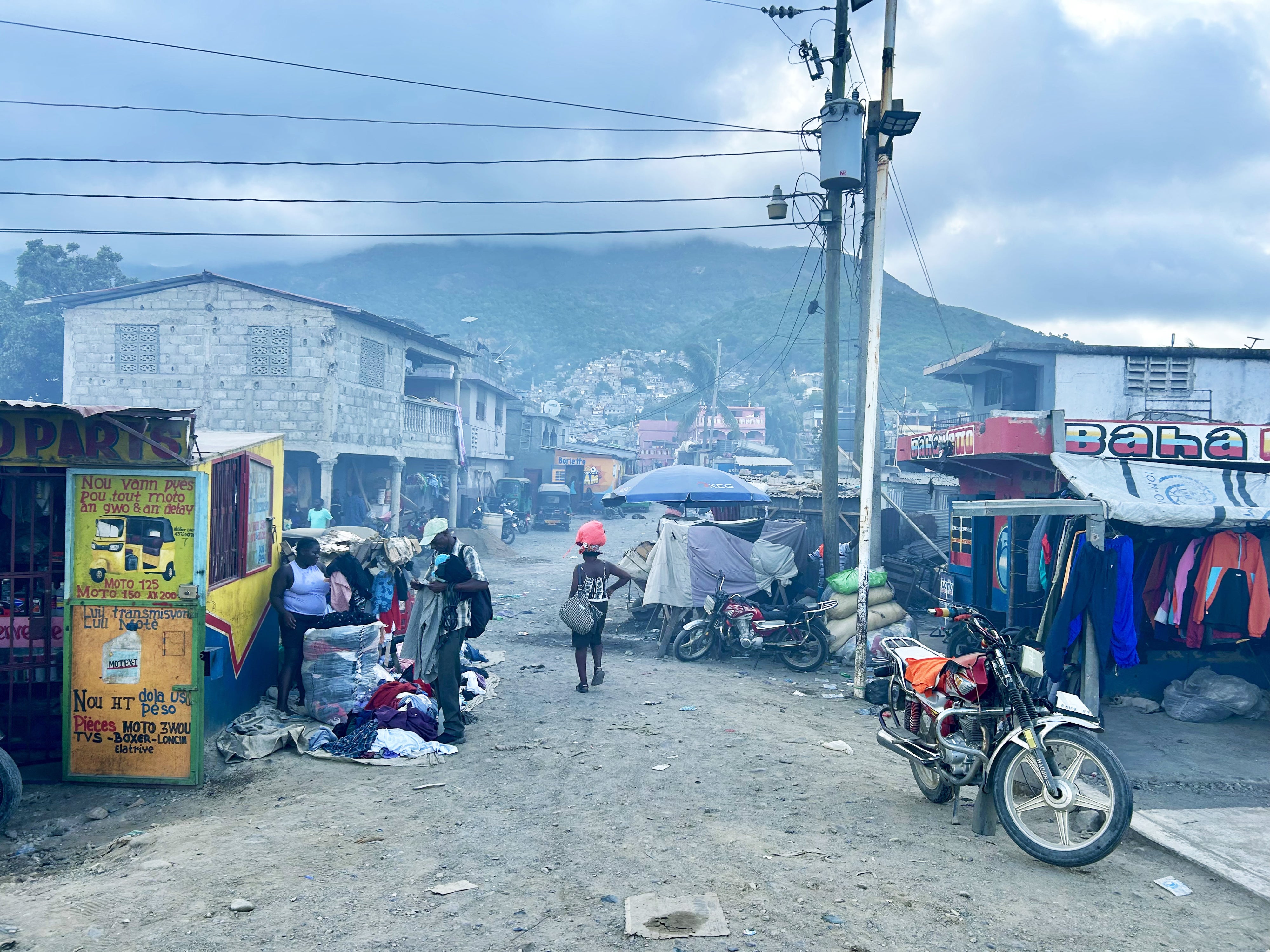 Street vendors and residents of Cap-Haïtien, Haiti, August 2026.